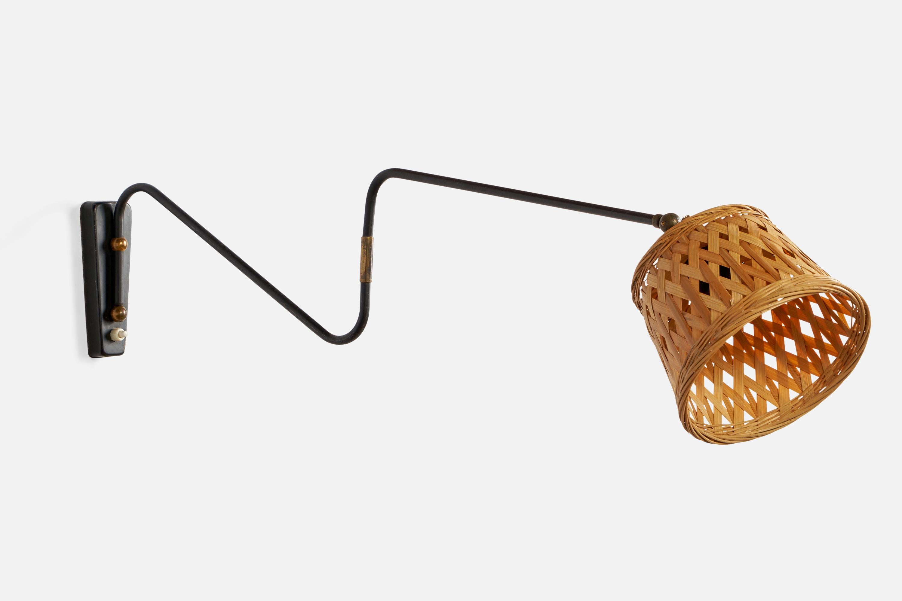 An adjustable brass, black-lacquered metal and rattan wall light designed and produced in Denmark, 1940s.

Overall Dimensions (inches): 5.75” H x 7.2” W x 33” D
Back Plate Dimensions (inches): 6” H x 2.15” W x 0.9” D
Bulb Specifications: E-26