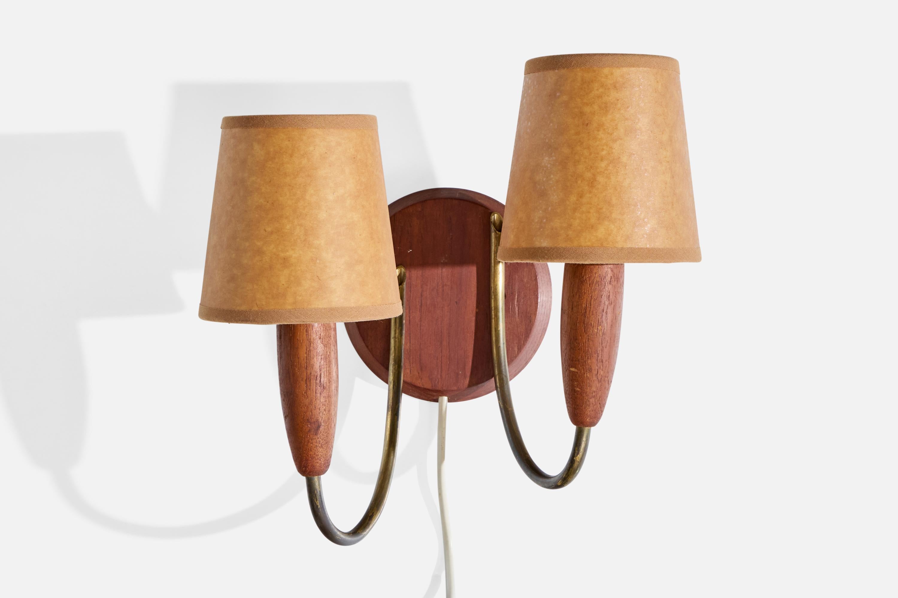 A teak, brass and brown parchment paper wall light designed and produced in Denmark, c. 1950s.

Overall Dimensions (inches): 10.5