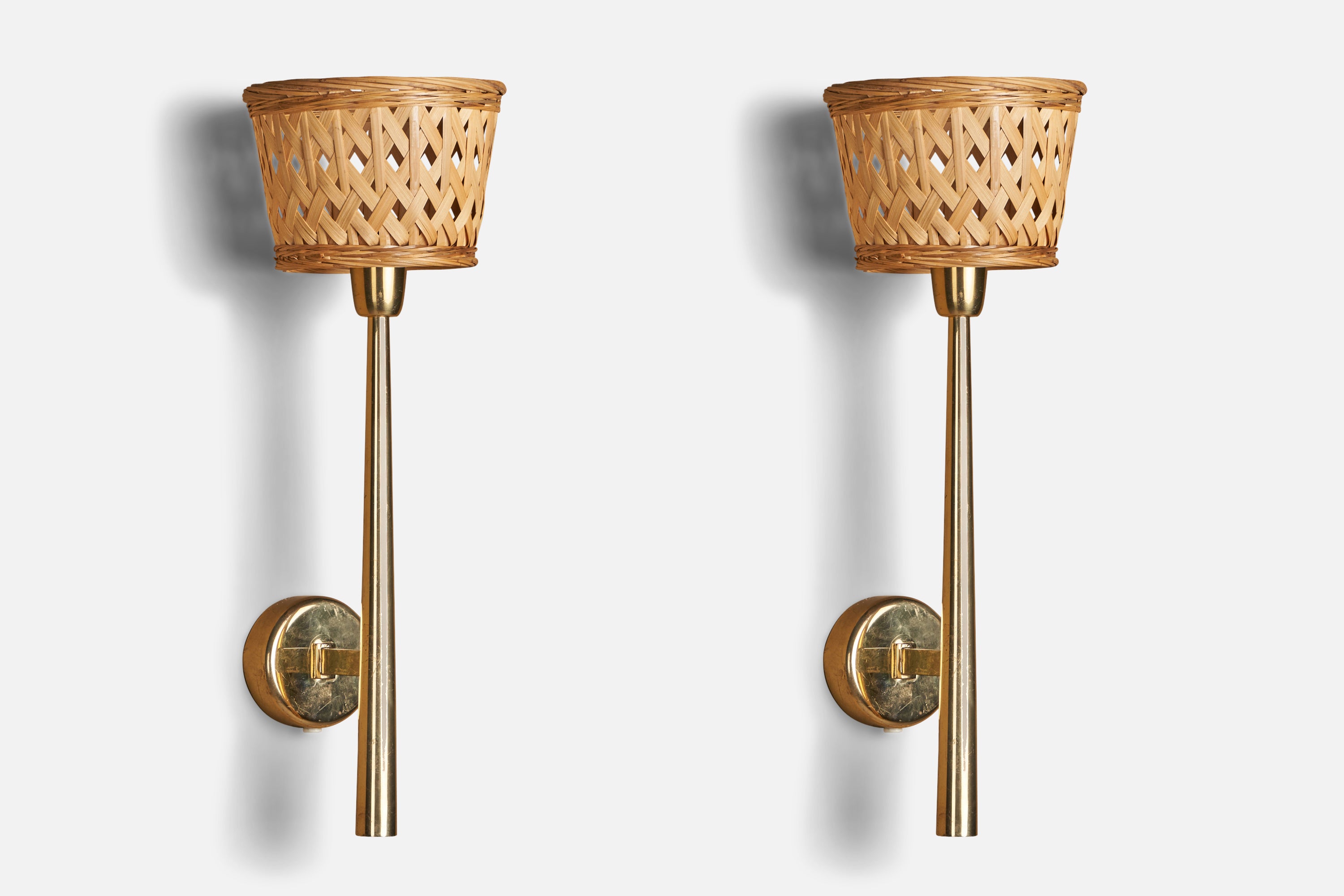 A pair of brass and rattan wall lights, designed and produced in Denmark, 1940s.

Overall Dimensions (inches): 17.75