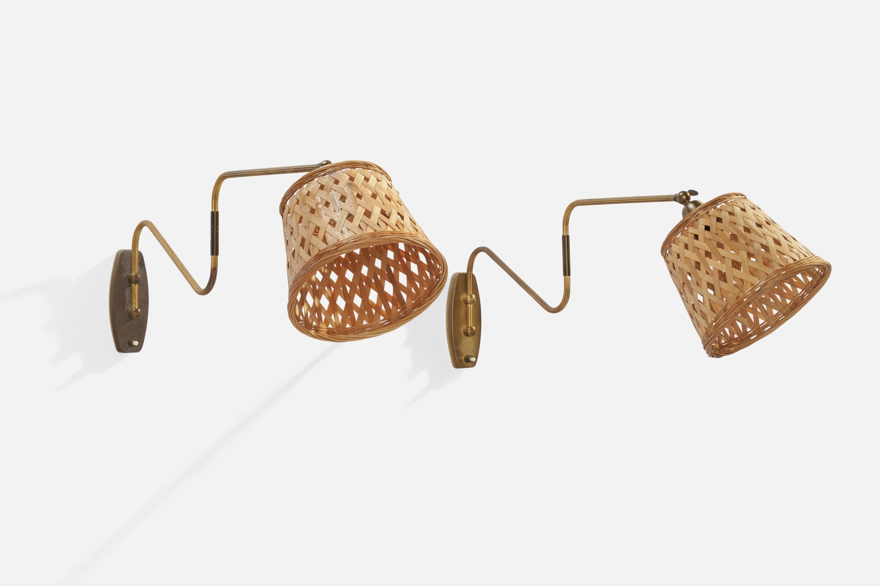 A pair of brass and rattan wall lights designed and produced in Denmark, 1940s.

Overall Dimensions (inches): 9.5” H x 12” W x 24” D
Back Plate Dimensions (inches): 5.75”  H x 2.25” W x .75”  D
Bulb Specifications: E-26 Bulb
Number of Sockets: 2
All