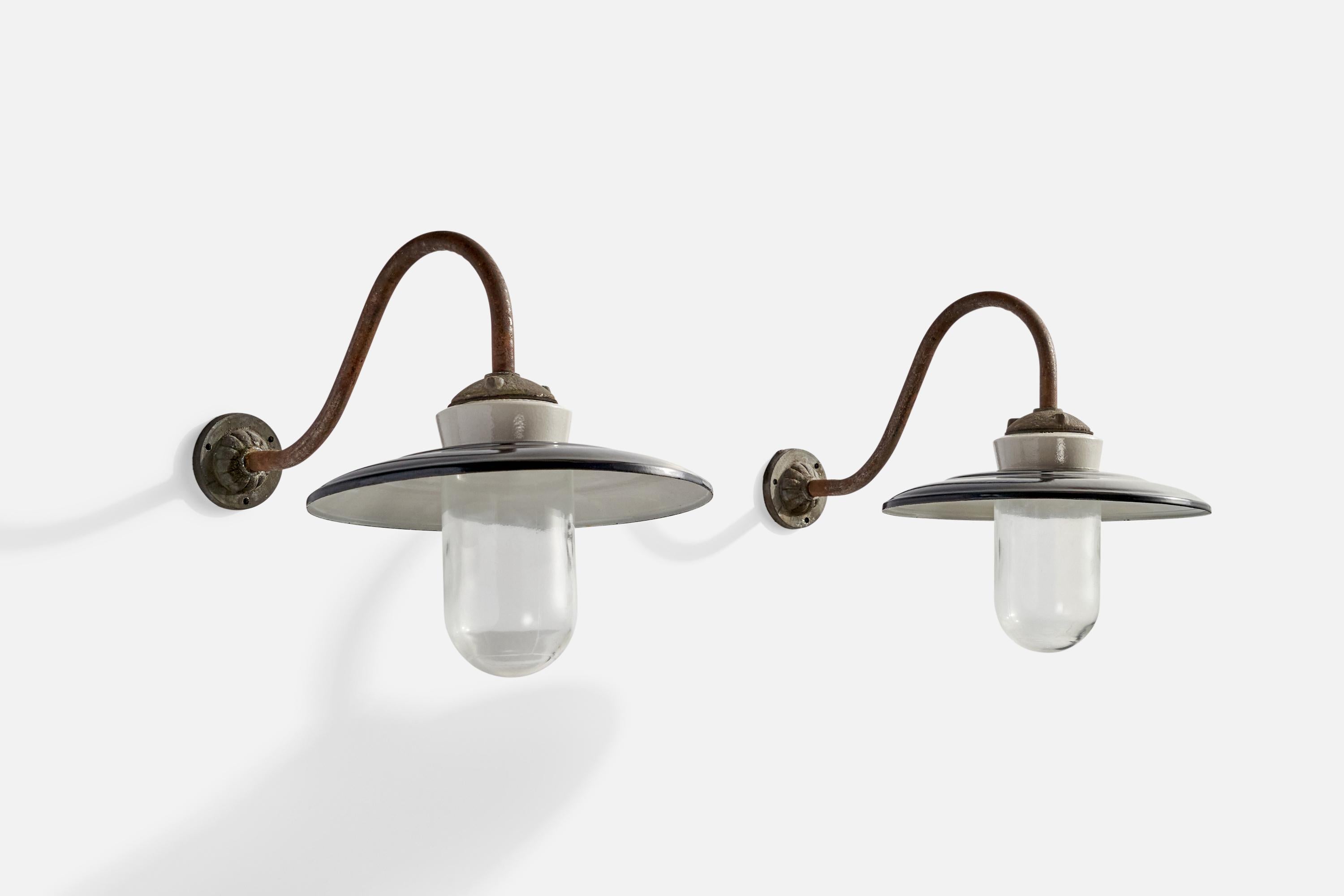 A pair of copper, glass, porcelain and white and black-lacquered metal wall lights designed and produced in Denmark, c. 1940s.

Overall Dimensions (inches): 13.77” H x 11.87” W x 21”  D
Back Plate Dimensions (inches): 3.33” H x 3.33” W x 1.34”