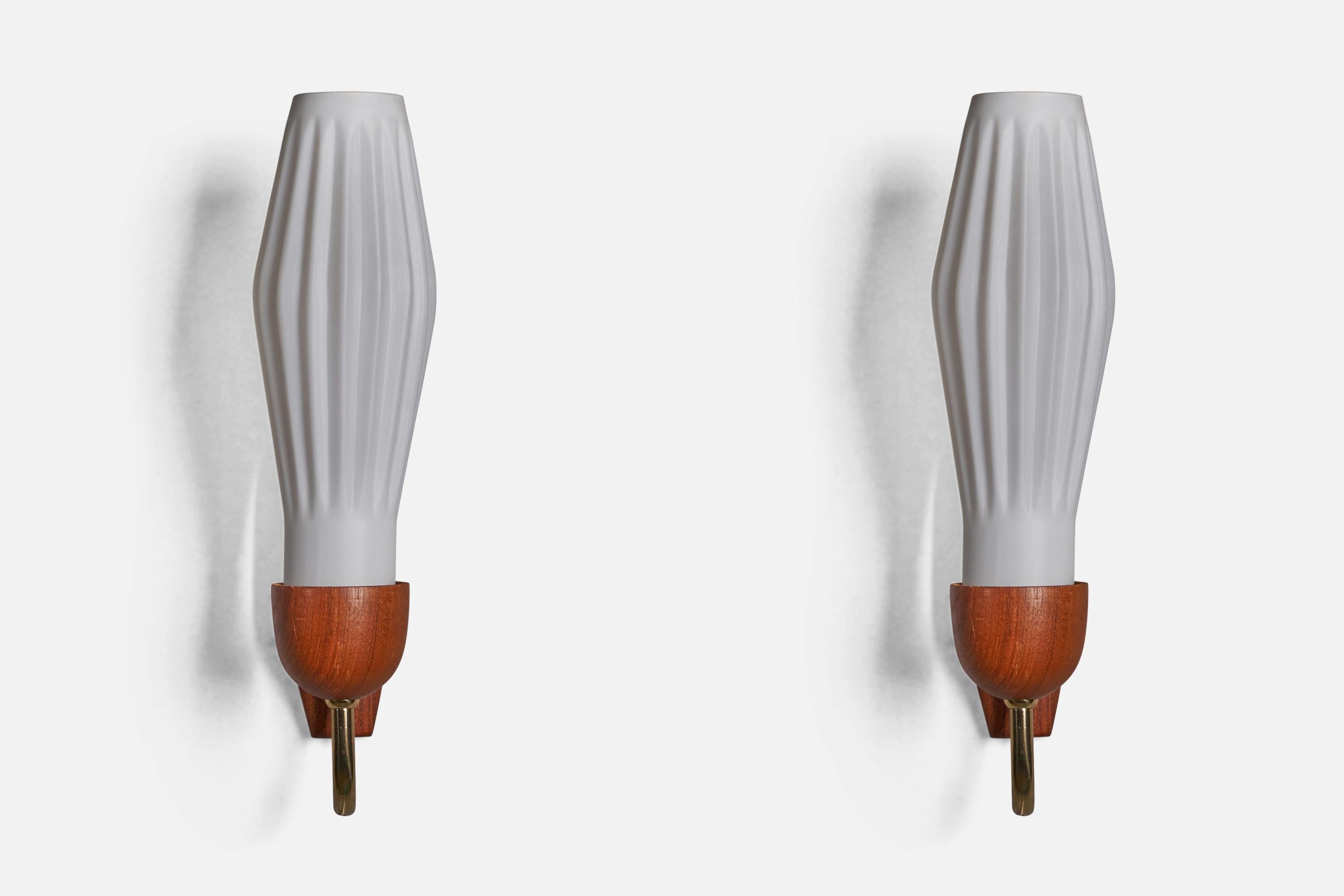 A pair of glass, brass and teak wall lights, designed and produced in Denmark, 1950s

Overall Dimensions (inches): 12