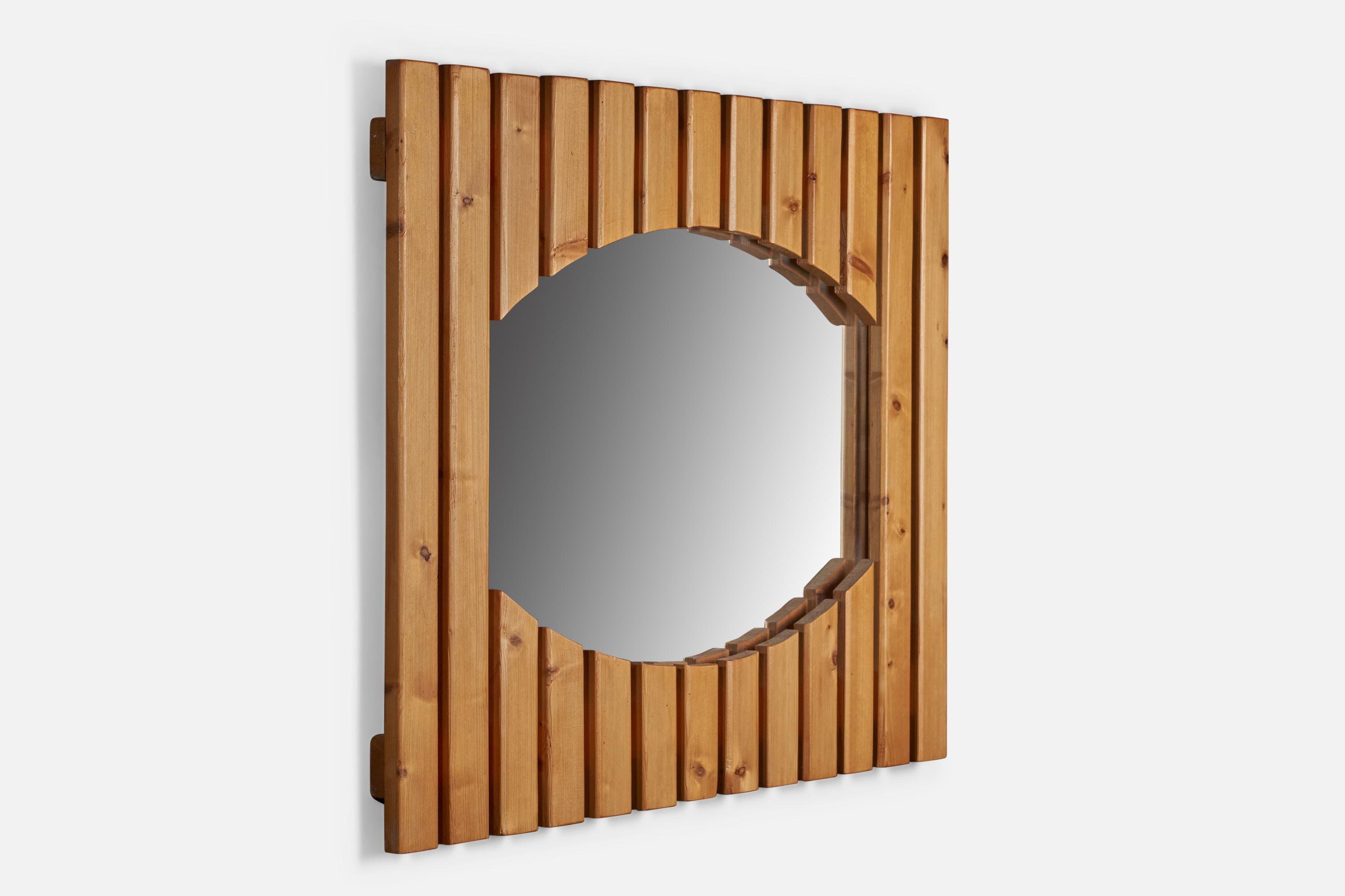 A sizeable slated pine wall mirror designed and produced in Denmark, 1970s.