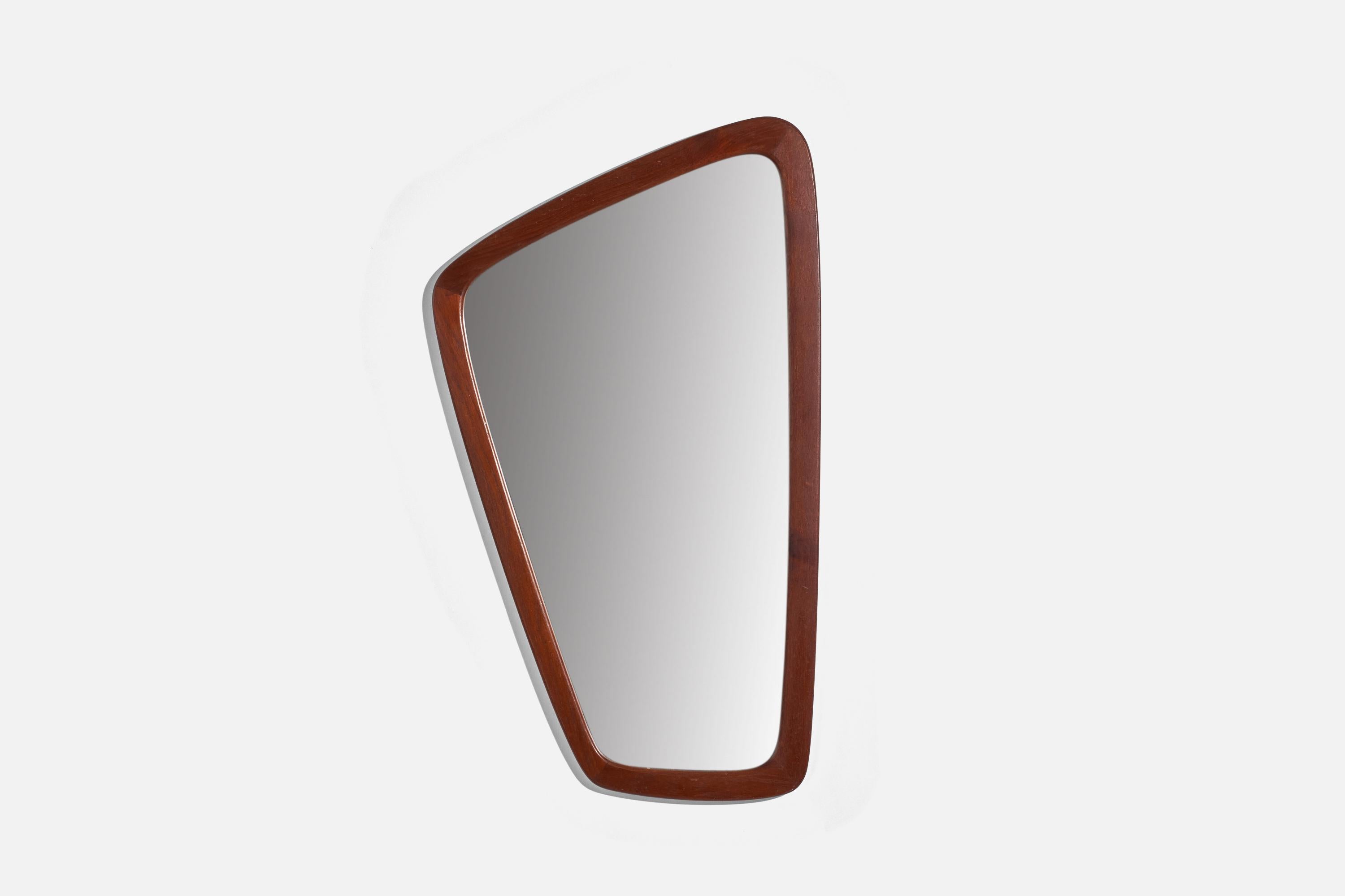 A teak wall mirror designed and produced in Denmark, 1950s. 