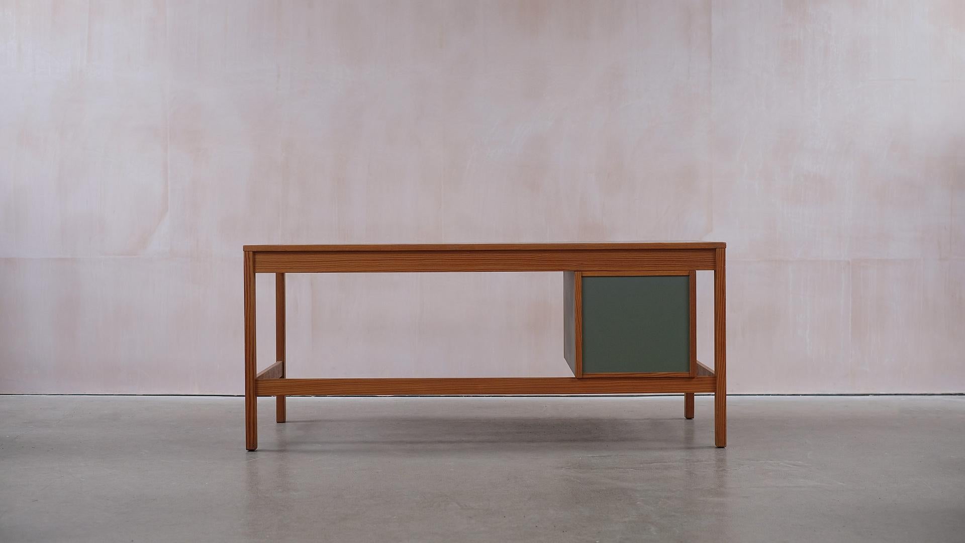 Wonderful desk in solid Pine with contrasting green/grey linoleum top surface designed by architect Bernt Petersen, Denmark 1960’s. Ultra high quality with fantastic details throughout and a perfect patina. Very architectural proportions and design