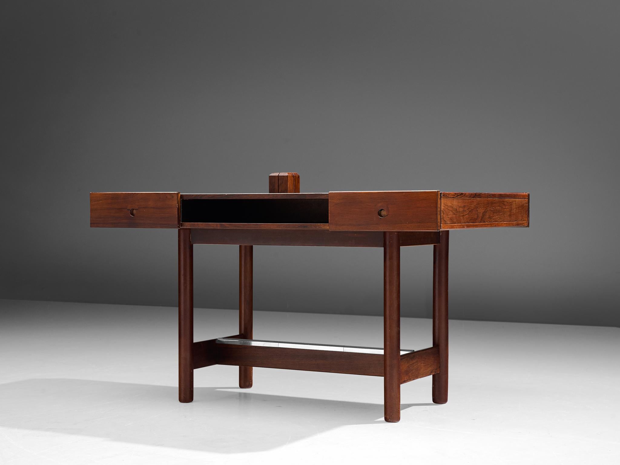 Desk, rosewood and metal, Denmark, 1960s

Scandinavian Modern desk in the manner of Peter Hvidt and Orla Mølgaard. Simplistic and functional design, for instance the drawers that are placed below the desk top. Between the drawers is an open
