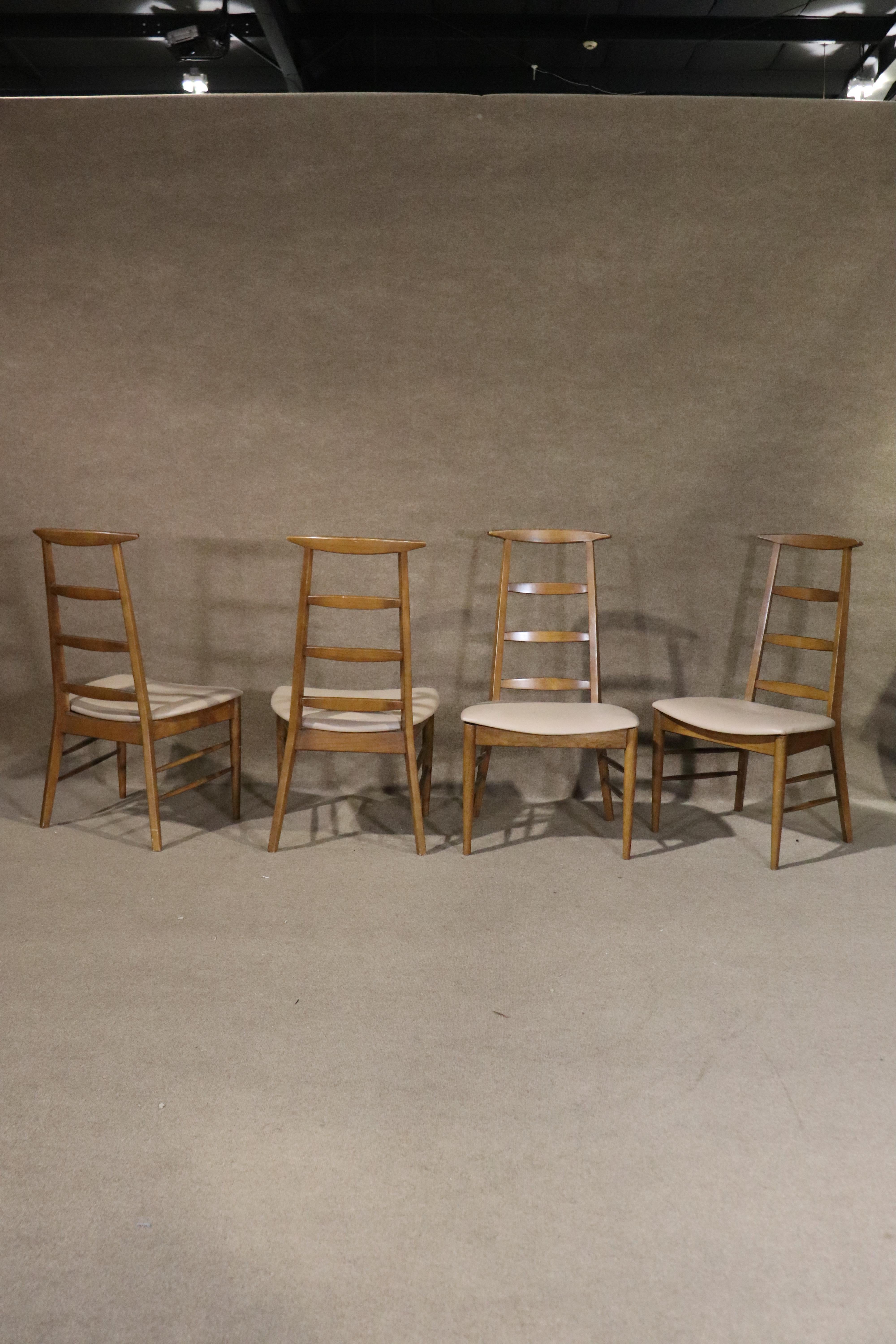 Set of four dining chairs by Farstrup Mobler in Denmark. Ladder backs with vinyl seats.
Please confirm location NY or NJ
