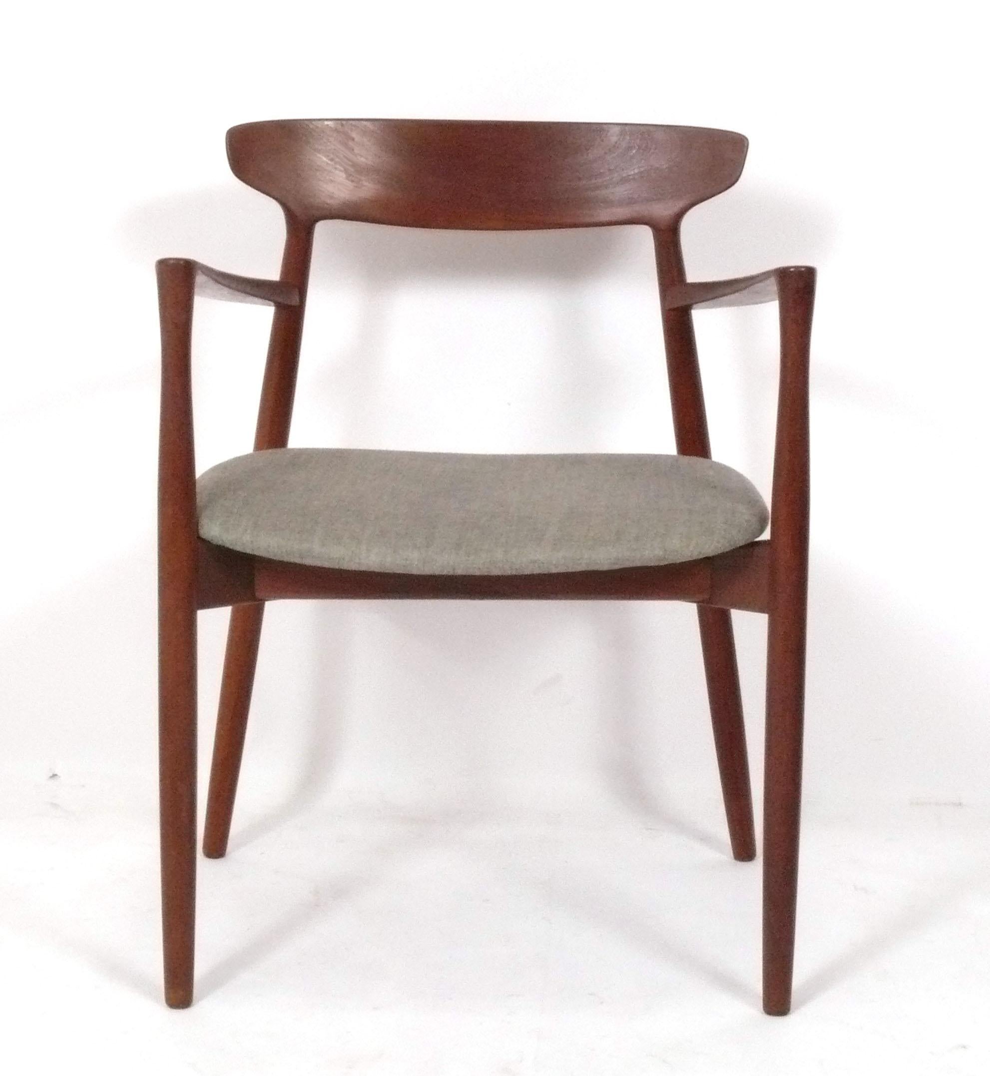 Danish Teak Dining Chairs, designed by Harry Ostergaard for Randers Mobelfabrik, Denmark, circa 1960s. The set consists of two armchairs and two side chairs, four chairs total. The seats are currently being reupholstered and can be completed in your
