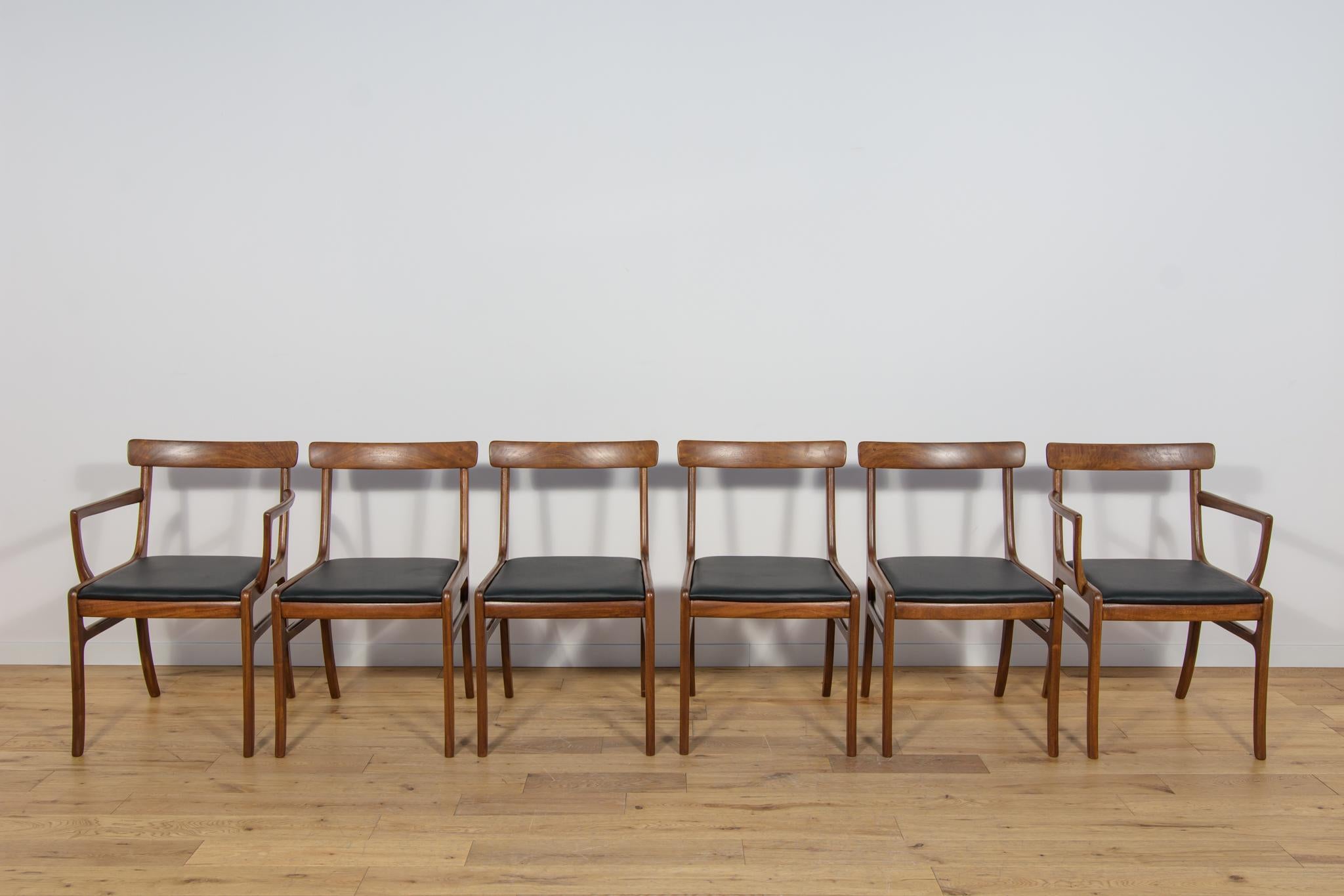 This set of 6 mahogany Rungstedlund chairs (4 chairs and two armchairs) designed by Ole Wanscher and produced during the 1960s and 1970s by Poul Jeppesen in St. Heddinge, Denmark. The mahogany elements have been cleaned from the old surface and