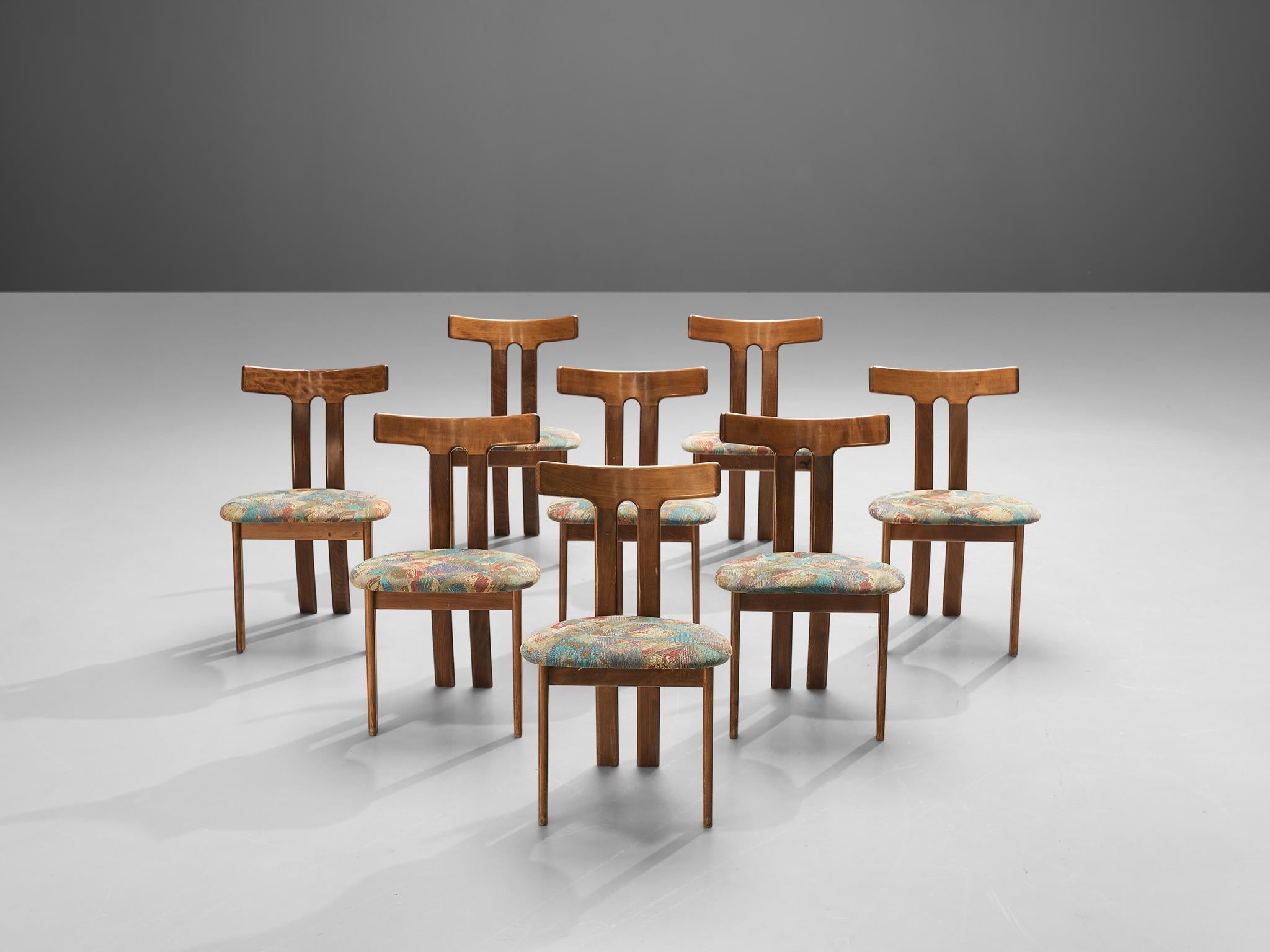 Set of 8 Danish dining chairs, wood, fabric upholstery, Denmark, 1960s

Danish Dining chairs designed in the 1960s. The wonderful T-shaped backrest has a strong expression. From the horizontal backrest the two vertical legs run downwards. Due to the