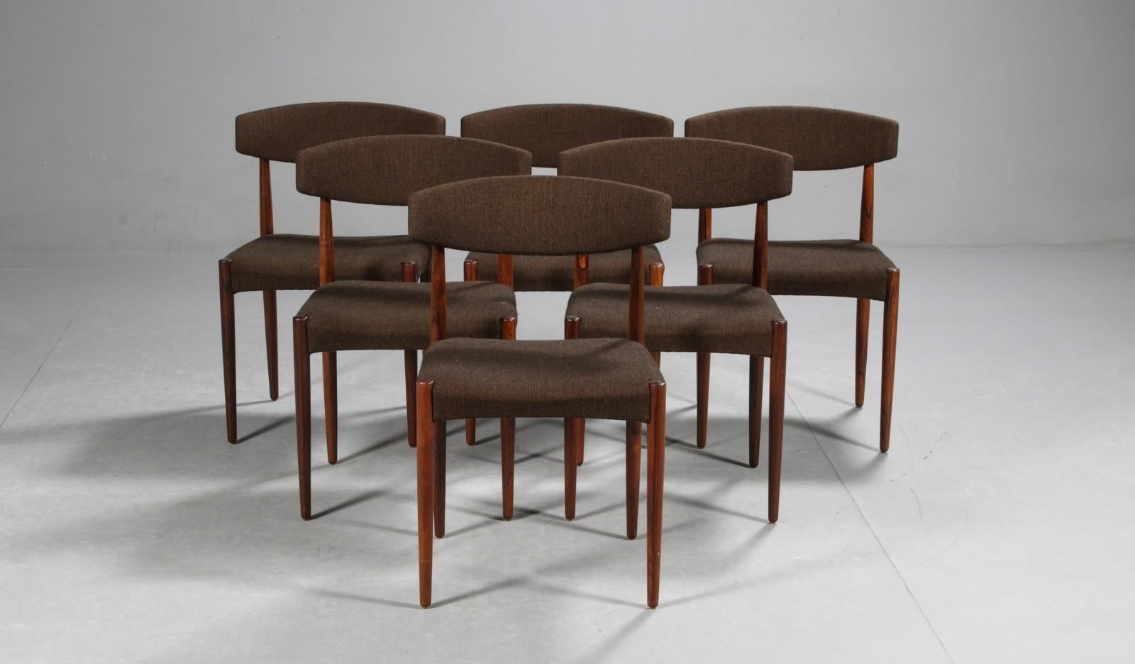 Danish furniture manufacturer. Dining chairs with solid hardwood frame, seat and back newly upholstered in brown wool. 1960s. Sh. 45 cm. Some small stains on fabric on seats.