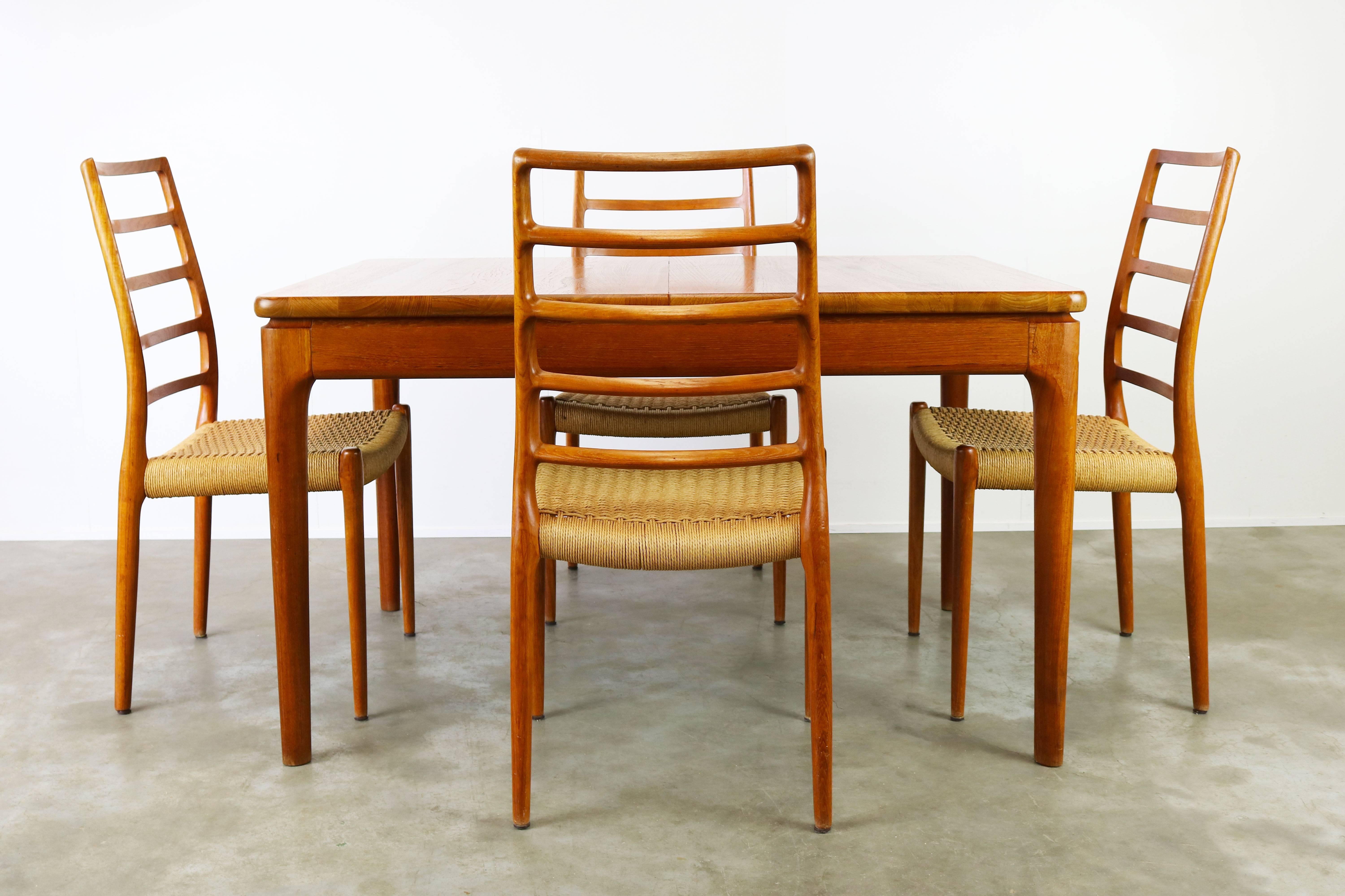 Magnificent Danish design dining room set in solid teak designed by Niels Otto Moller & Glostrup. The set consists of four very rare model 82 ''Highback'' chairs designed my Niels Otto Moller and produced by J.L. Mollers Mobelfarbik in solid teak
