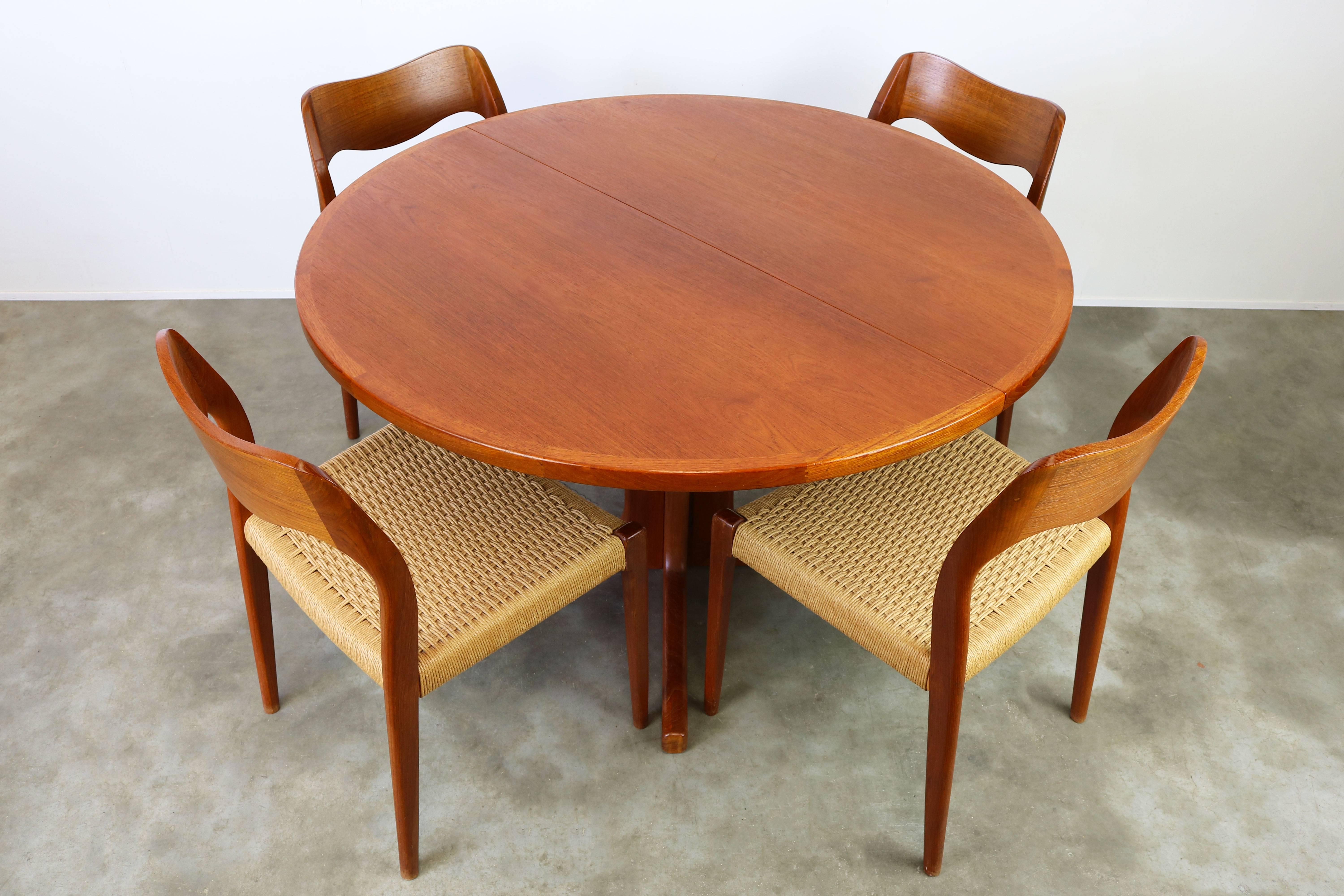 Magnificent Danish dining room set by Niels Otto Moller for JL Moller Mobelfabrik, 1950. The set consists of four teak and papercord model.71 chairs and original matching round teak table (extendable). Set is in wonderful original condition however