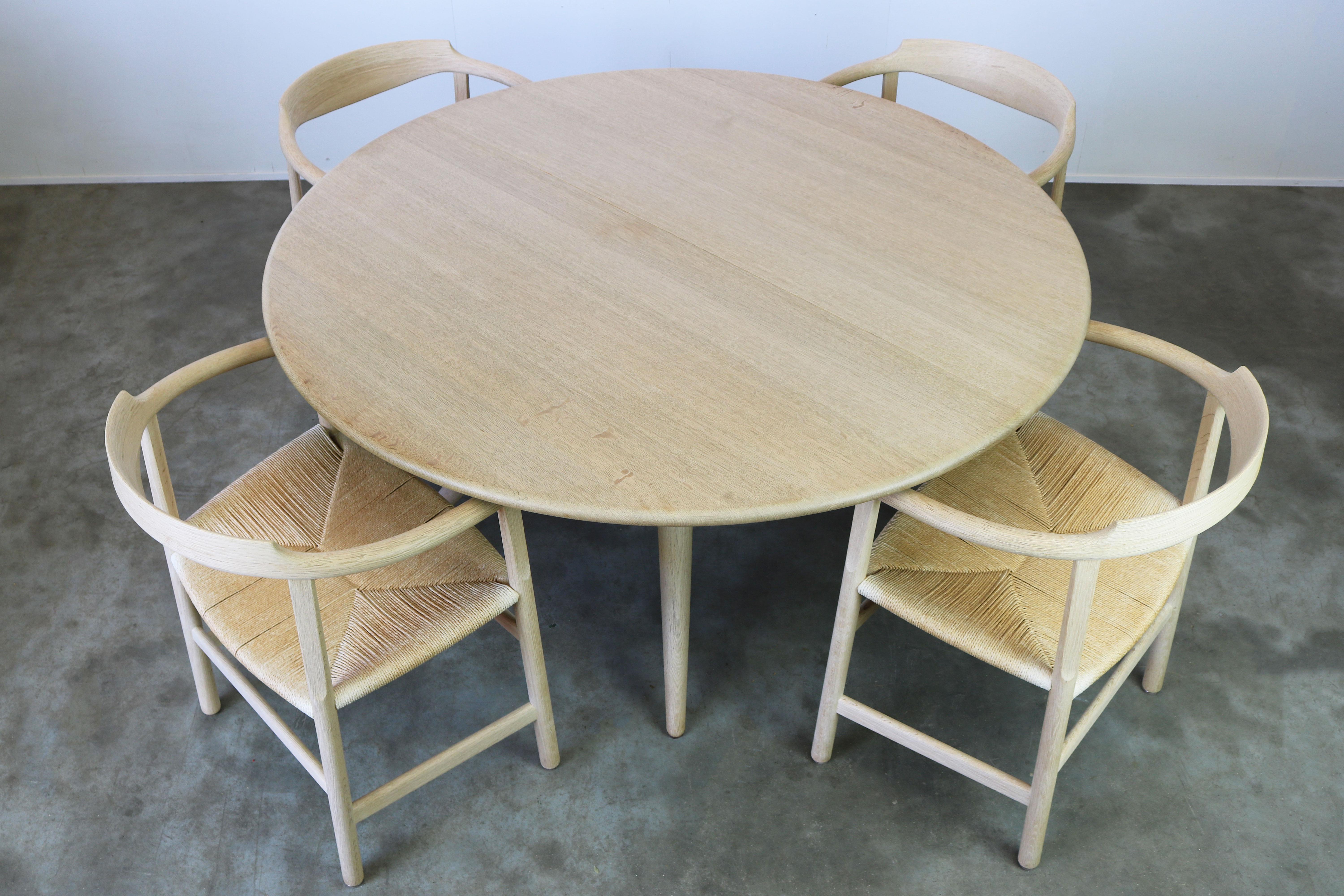 
Magnificent Danish dining room set in soaped oak designed by Hans J. Wegner for PP Mobler in 1982. The set is fully original and consists of four soaped oak papercord arm chairs Model: PP205 these are no longer in production and very rare and a