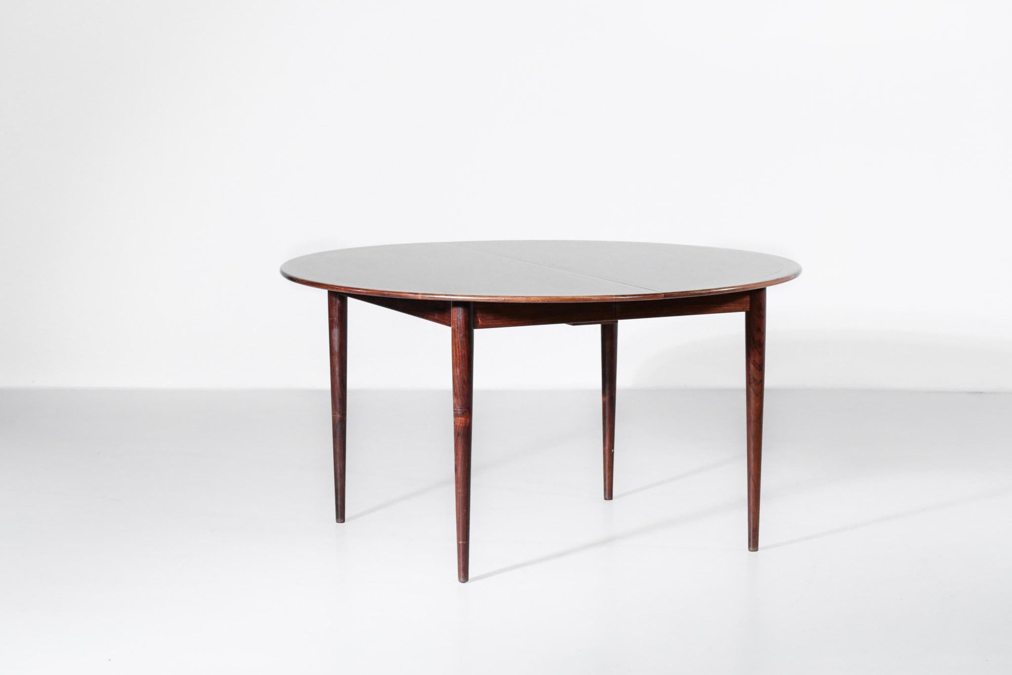 Rare Scandinavian dining table designed by Grete Jalk in rosewood. 2 extensions, measures: 55 cm each. Length from 135 cm to 245 cm (12 peoples) Stamp in the structure.