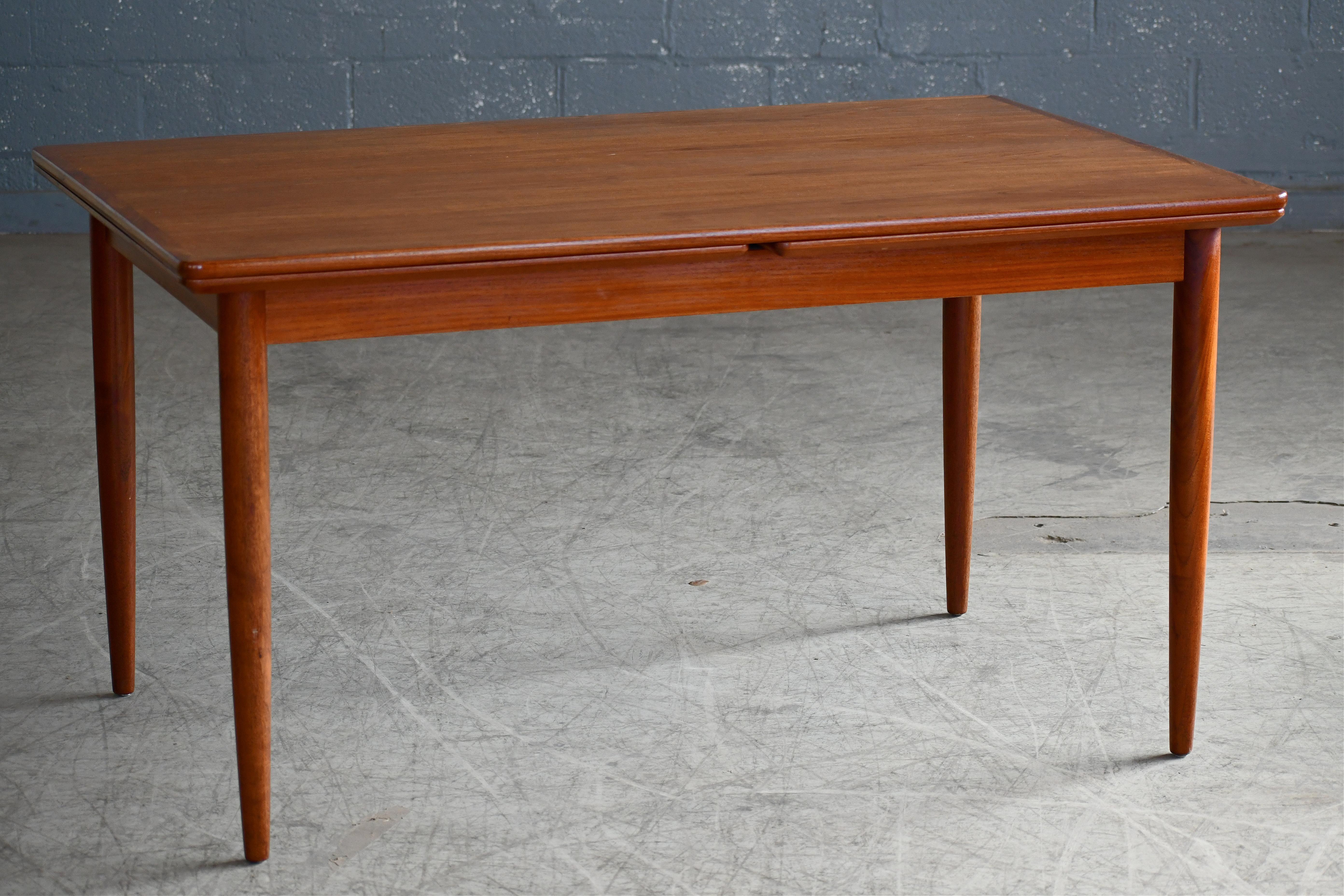 Scandinavian Modern Danish Dining Table in Teak with Pull Out Leaves 1960's 'v' For Sale