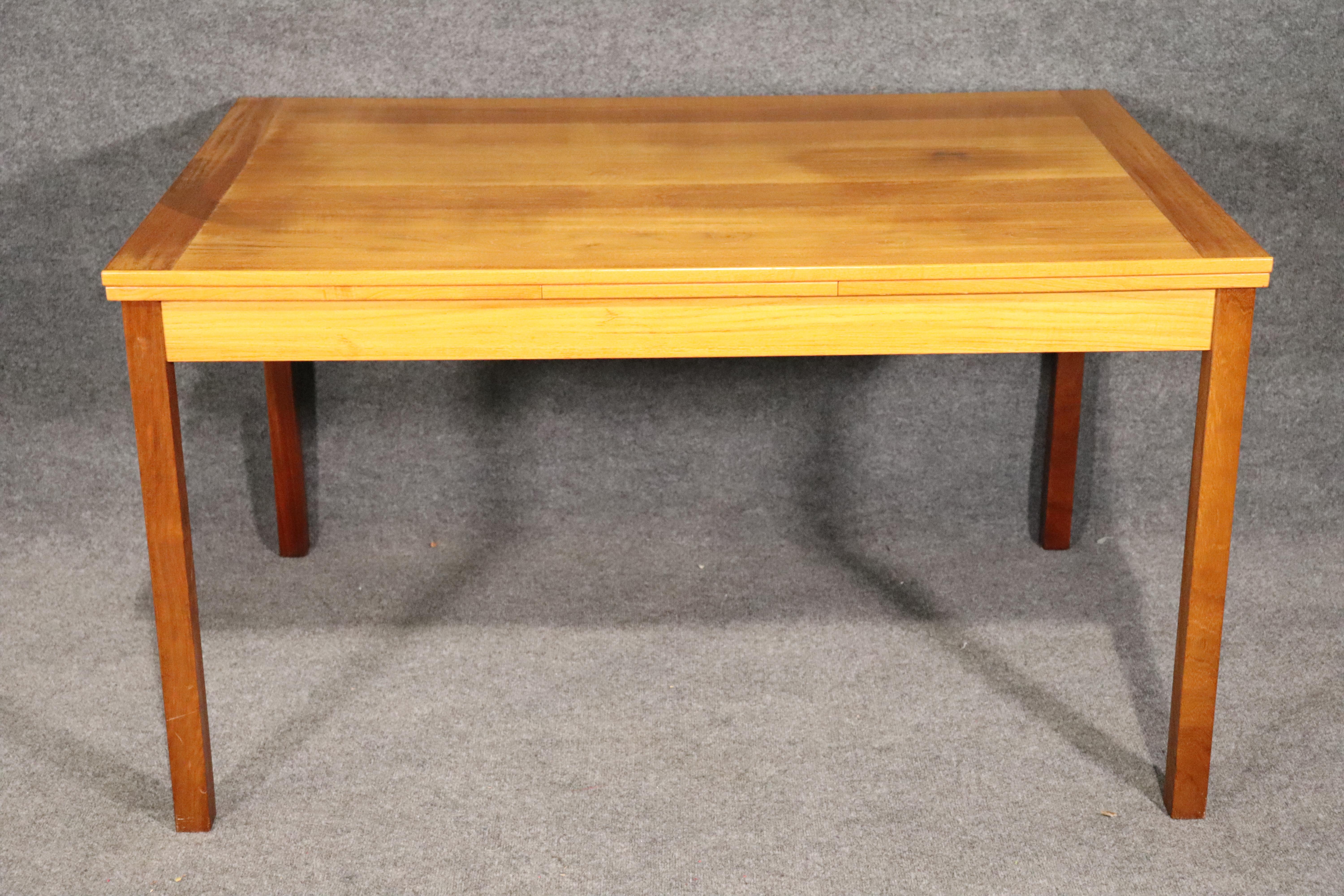 Mid-Century Modern Danish made dining table with expanding top. Goes from 54