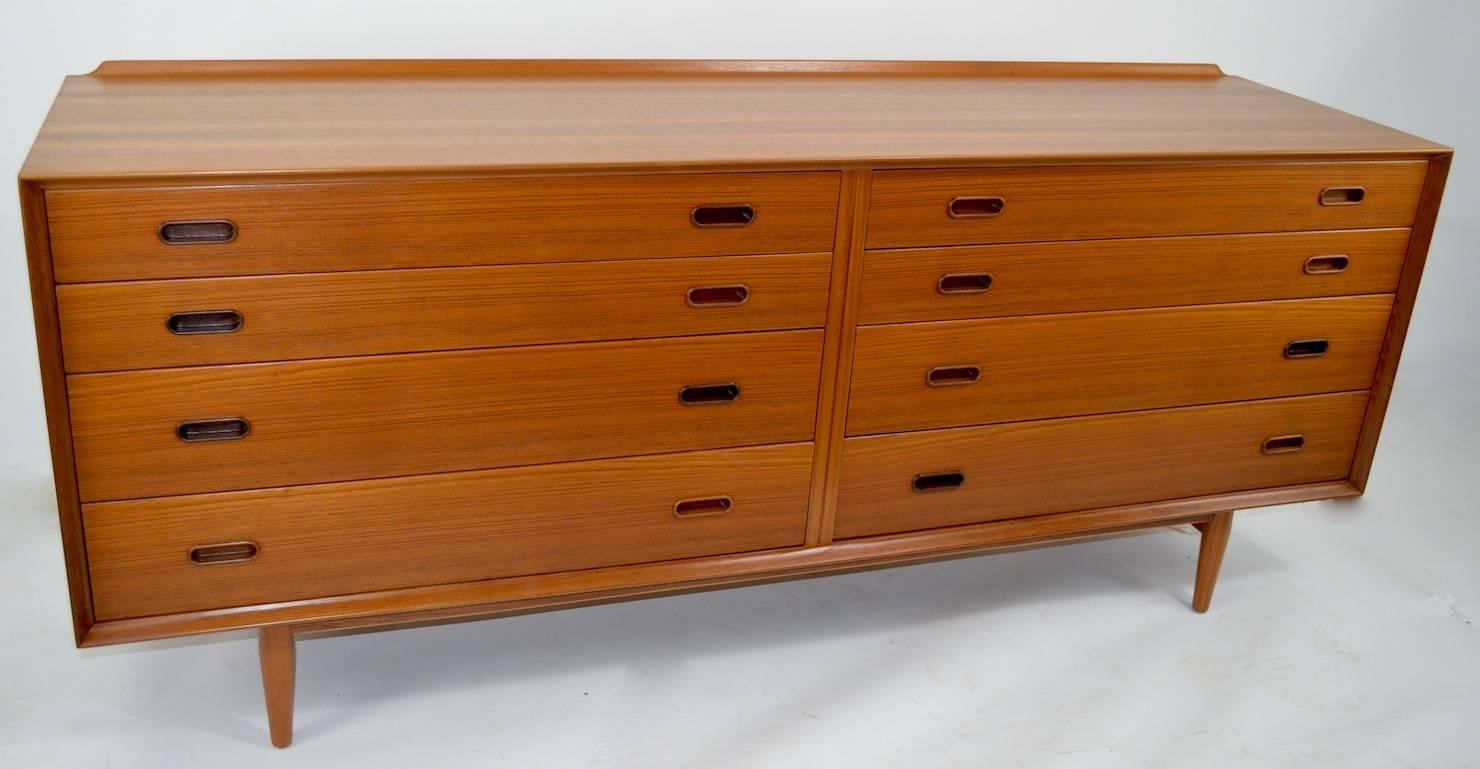 Danish teak double dresser, by Arne Vodder for Sibast Mobelfabrik. Hard to find form, eight-drawer double dresser. Superb example, professionally refinished to perfect condition.