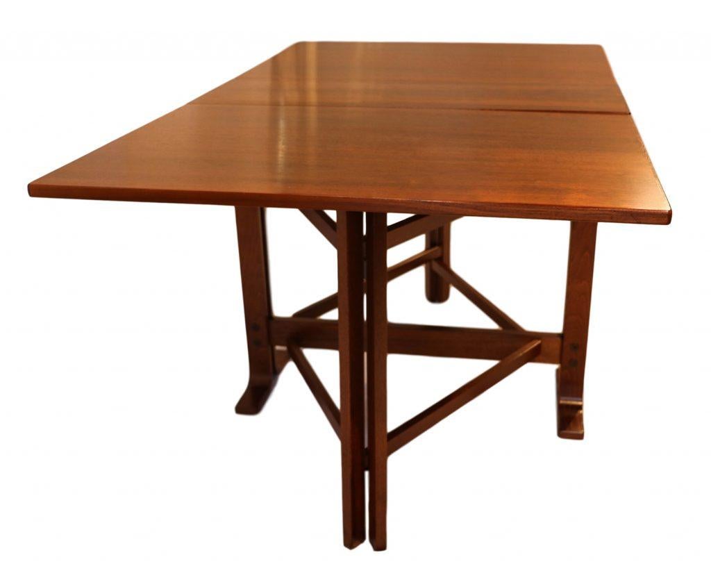 A teak drop leaf gate leg dining table in the manner of Bruno Mathsson. An exceptional work of Danish craftsmanship. This is an outstanding selection for serious collectors of Mid-Century Modern Danish. The leaves hang from the table, with original