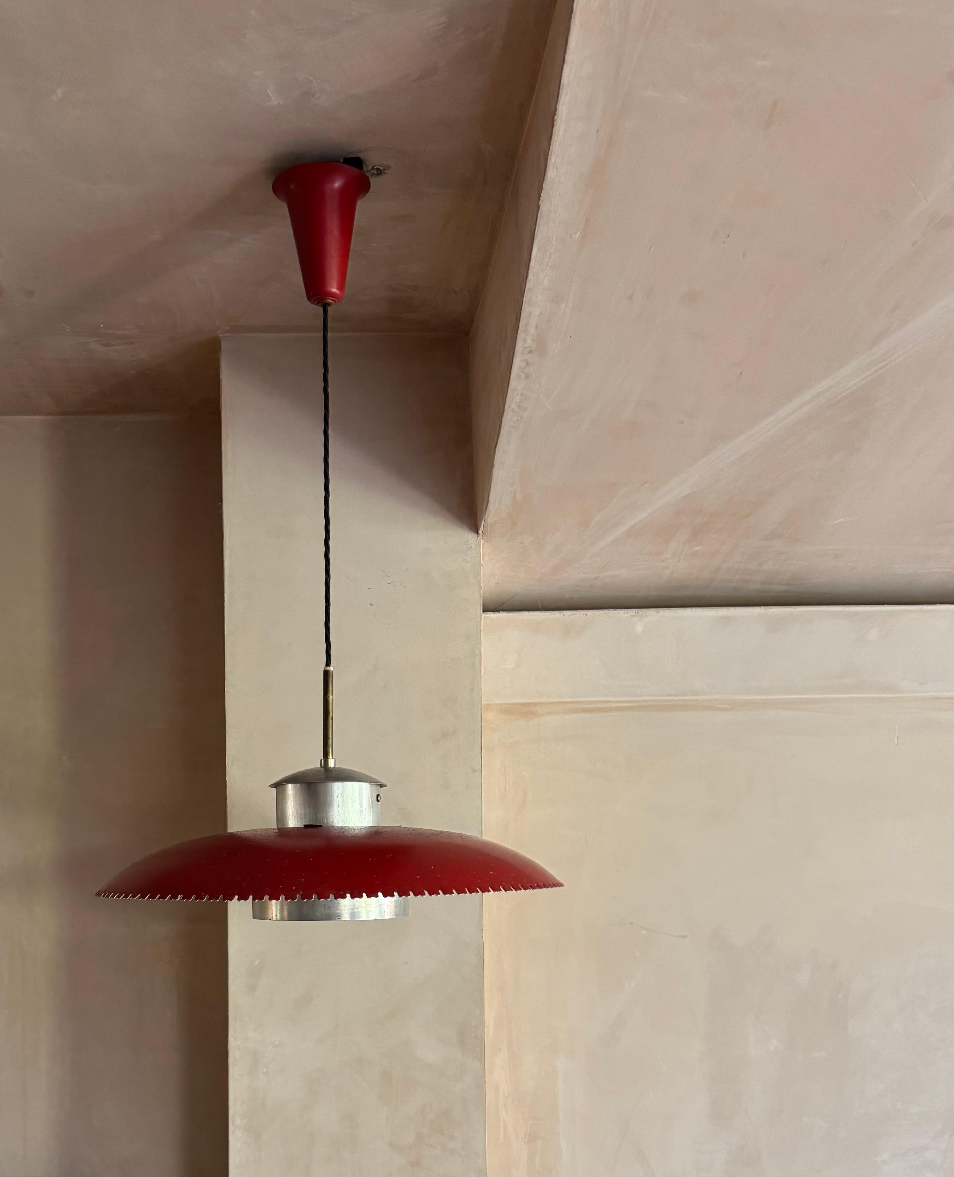 Early 1950’s red enamel and aluminium Danish ceiling pendant light. Some paint loss and rust marks to top of shade but otherwise in good original condition.