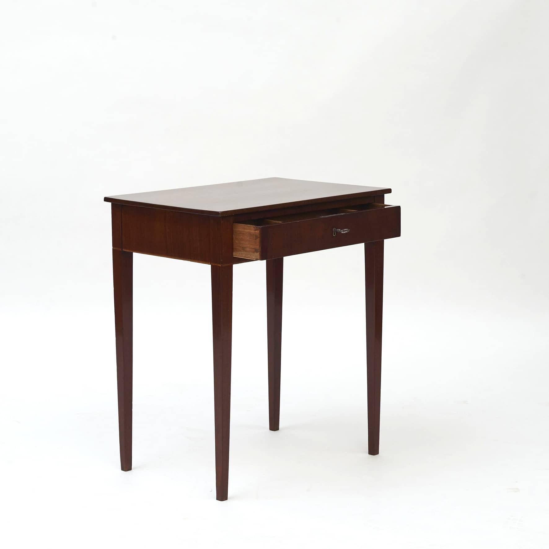 Elegant empire side table in Cuban mahogany.
Rectangular top with satin wood marquetry trim to the apron.
One drawer with original lock and key.

Copenhagen c. 1810.