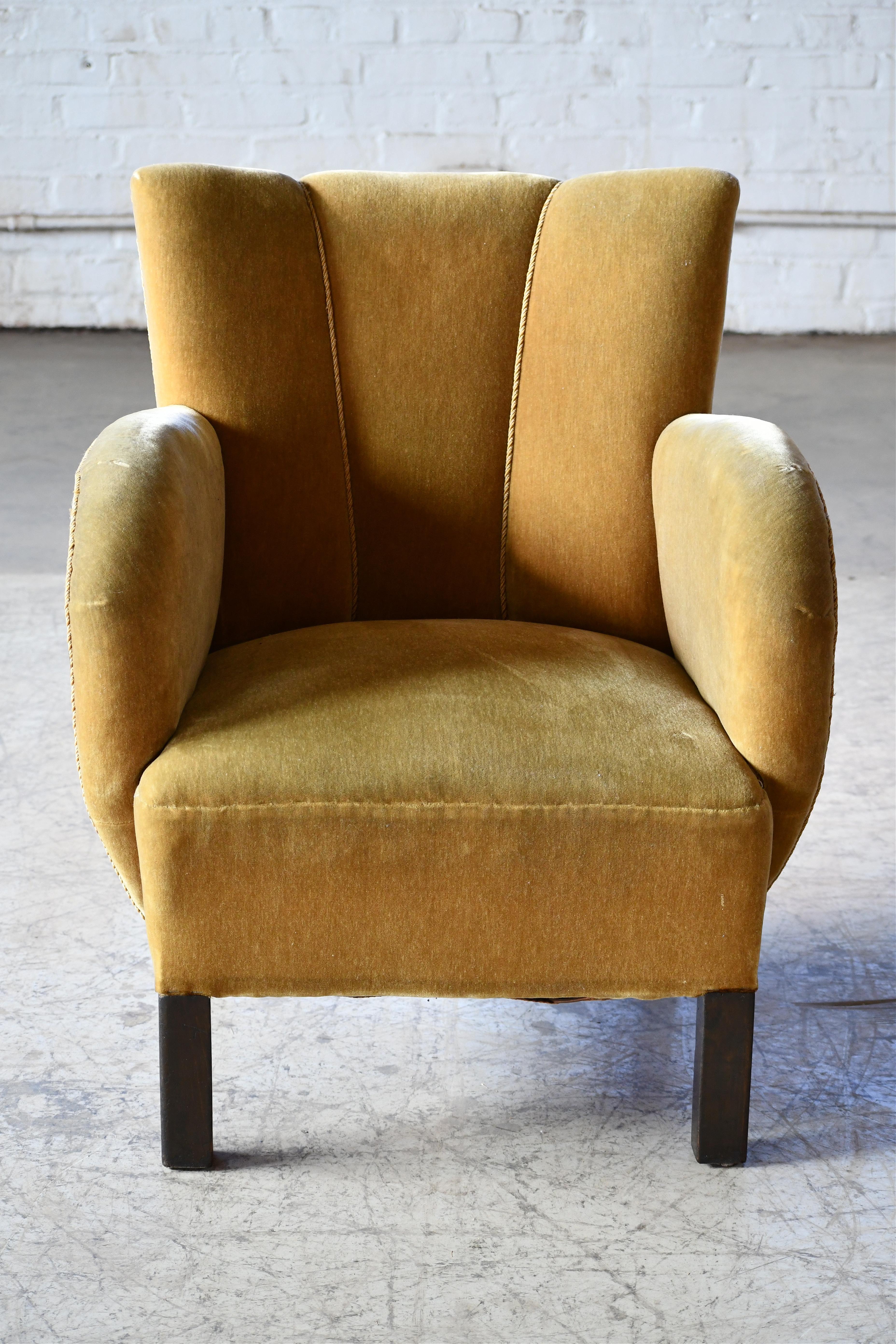 Super charming and very elegant  Danish small lounge chair from the late art deco period or early midcentury. The chair is unmarked but very likely made by Slagelse Mobelvaerk sometime in the 1930-40s. Very charming design with simple yet very