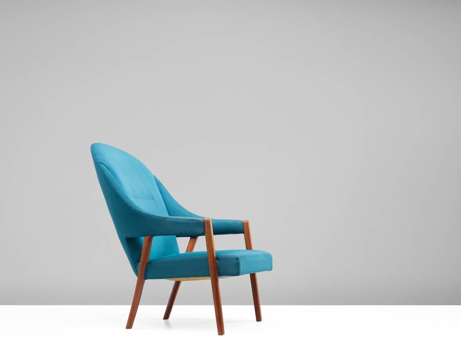 Easy chair, blue upholstery, teak, Denmark, 1950s. 

This sculptural lounge chair is upholstered in a bright blue fabric. The stately chair, which originates from the 1950s is an airy, sculptural example of the mostly minimalistic modern Danish