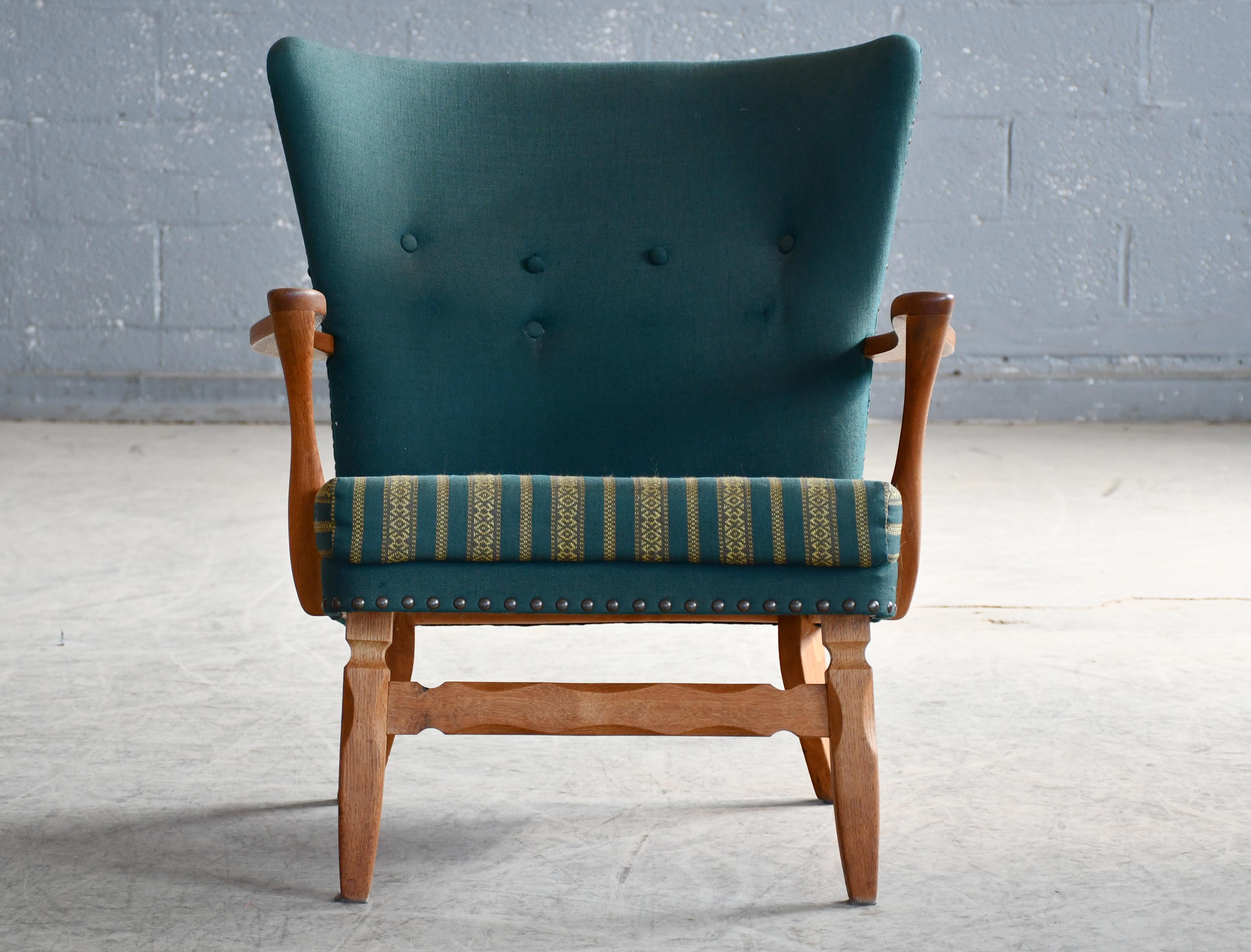 Super cool brutalist style Lounge chair in carved white oak attributed to Henning Kjærnulf made around 1970. Very typical of Kjærnulf.'s designs as he was known for combining the midcentury style with more brutalist rustic designs taking