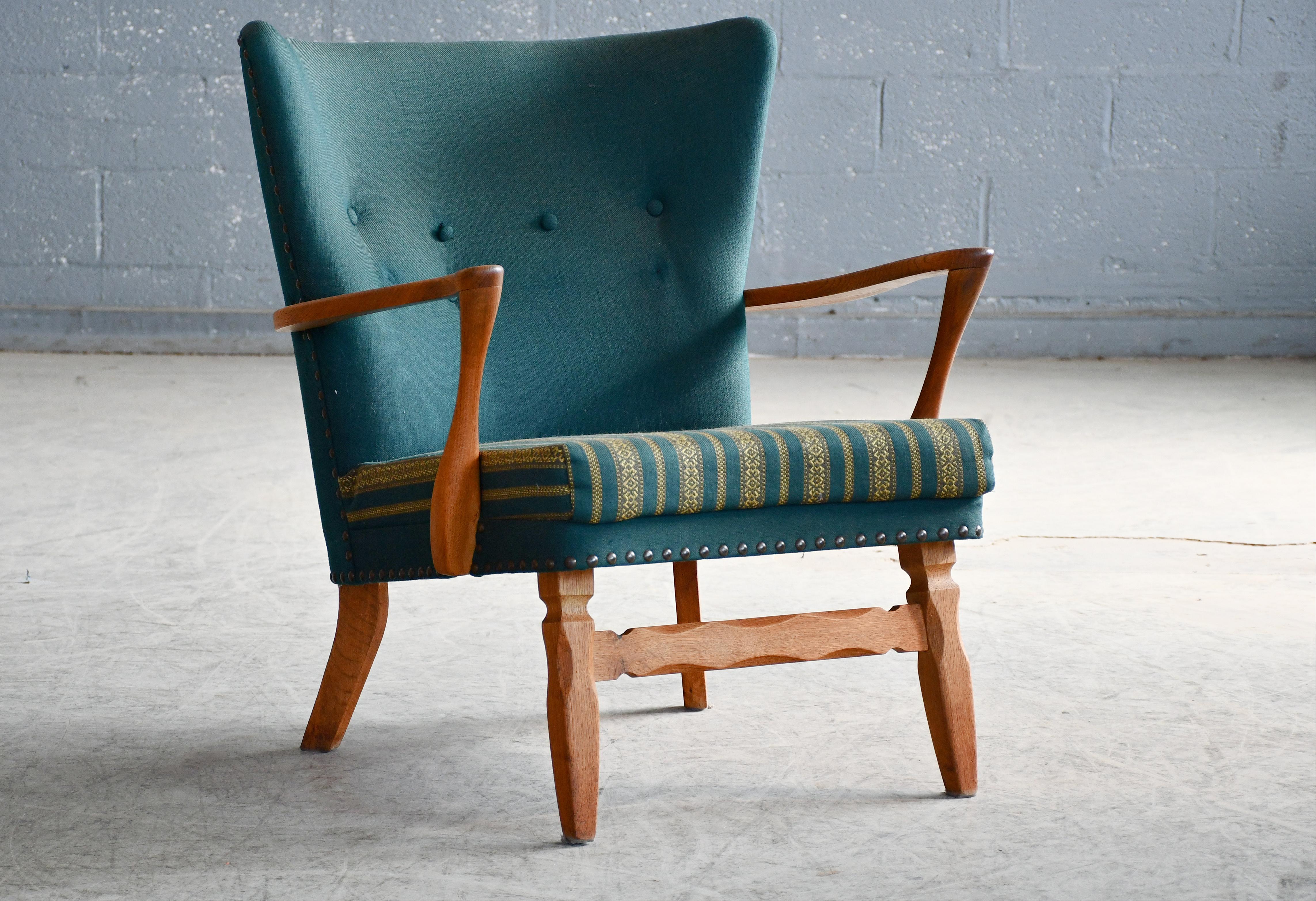 Mid-Century Modern Danish Easy with Carved Oak Base and Armrests attributed to Henning Kjærnulf For Sale