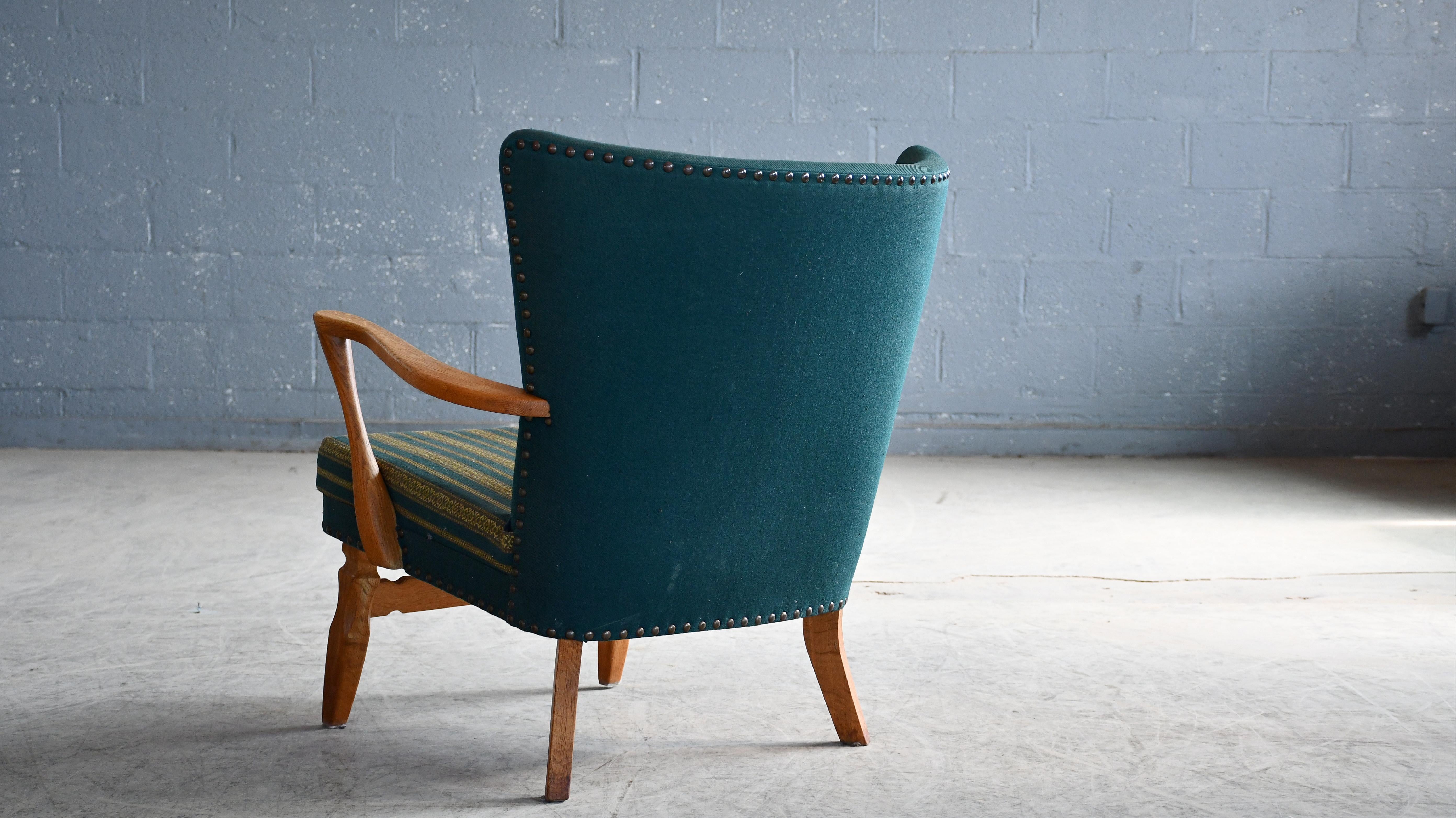 Late 20th Century Danish Easy with Carved Oak Base and Armrests attributed to Henning Kjærnulf For Sale