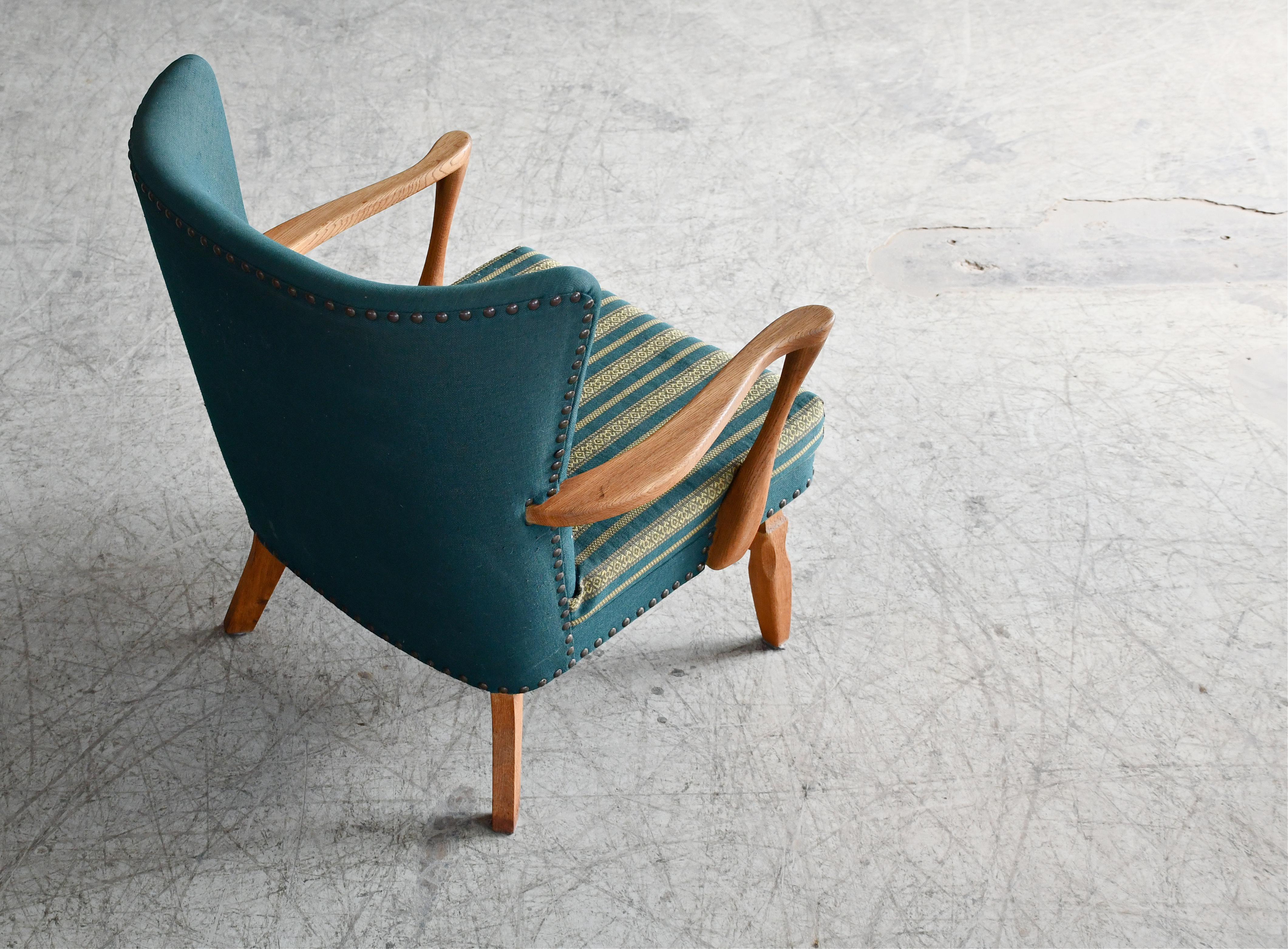 Danish Easy with Carved Oak Base and Armrests attributed to Henning Kjærnulf For Sale 1