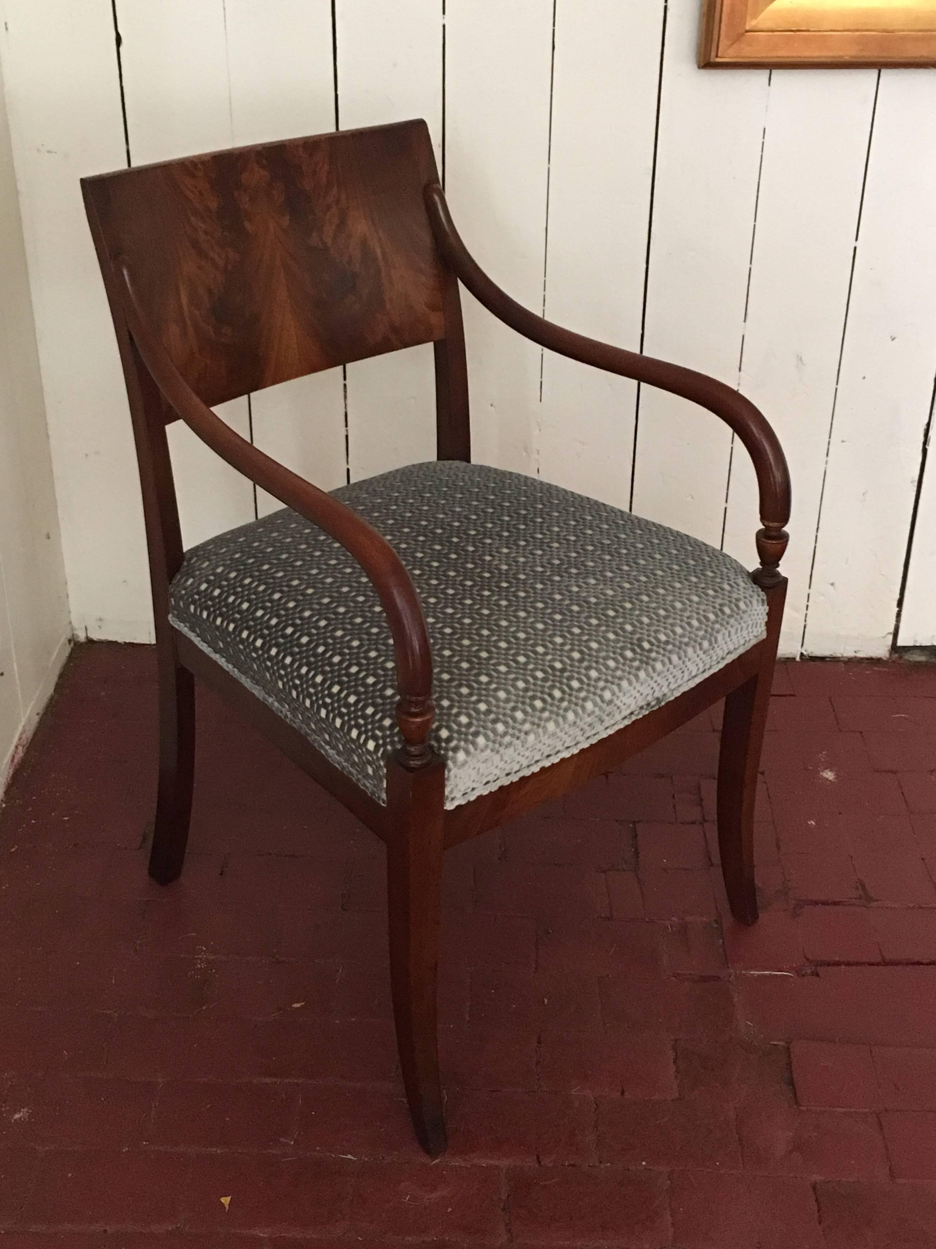 Stunning Danish Empire armchair with all the gracious and classic elegance of the era, ca. 1840. This is a perfect piece for additional seating or even as a desk chair. Simple yet striking in design, the early 19th century Danish Empire style served