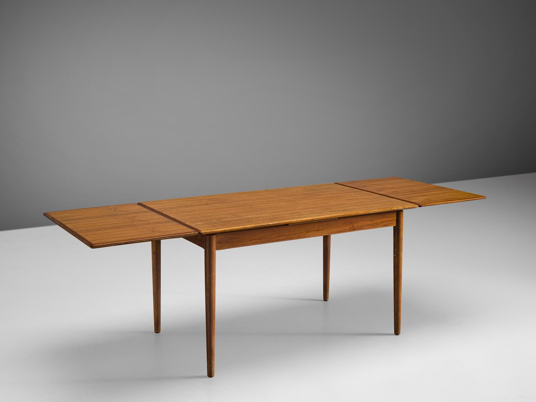 Dining table, teak, Denmark, 1950s

Crafted from exquisite teak wood in Denmark during the 1950s, this dining table displays a highly functional and timeless piece of mid-century Danish design. Its sleek and minimalist silhouette boasts a