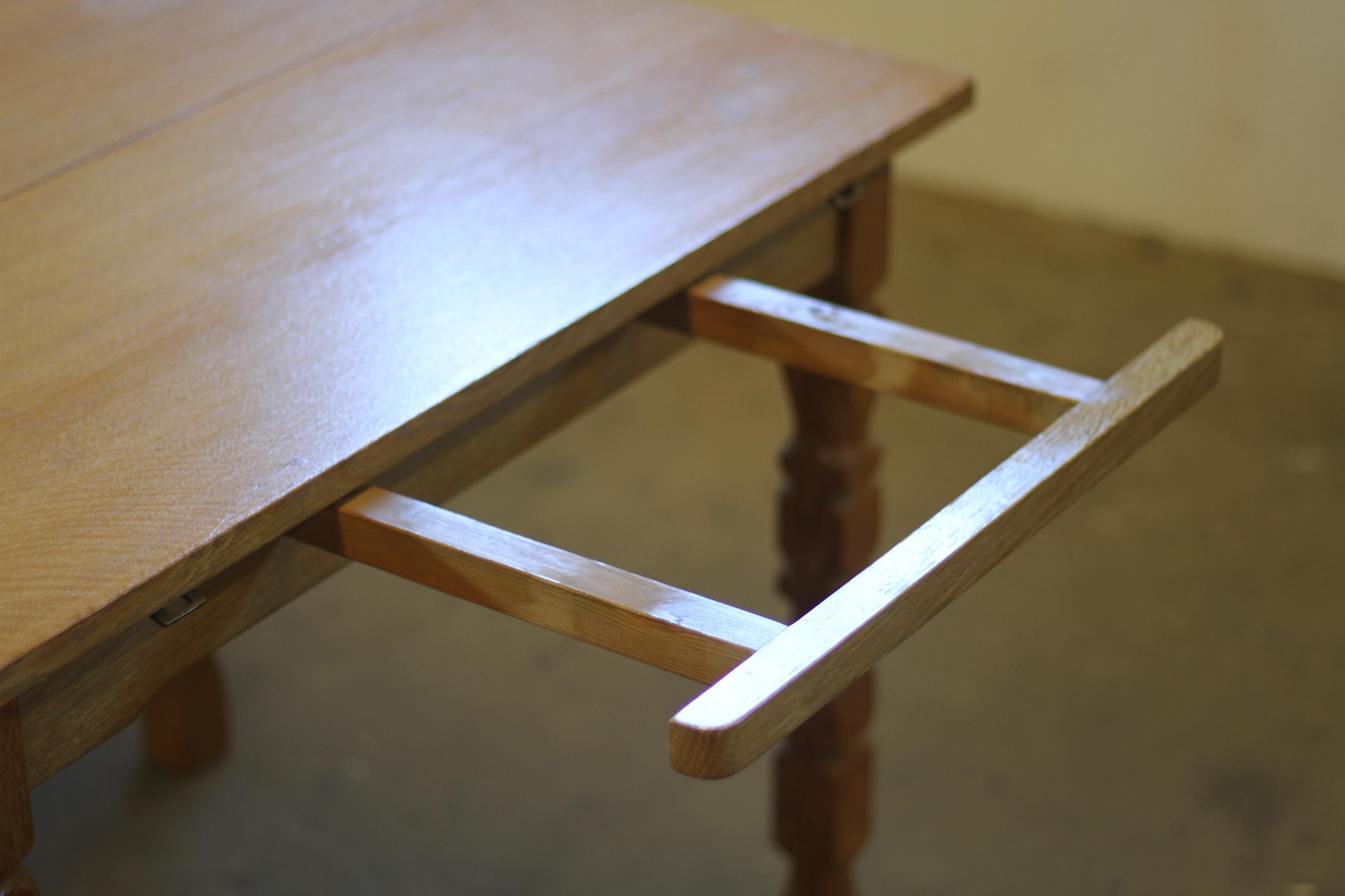 Danish Extendable Dining Table with leafs in Oak style of Henning Kjærnulf, 1960 For Sale 9