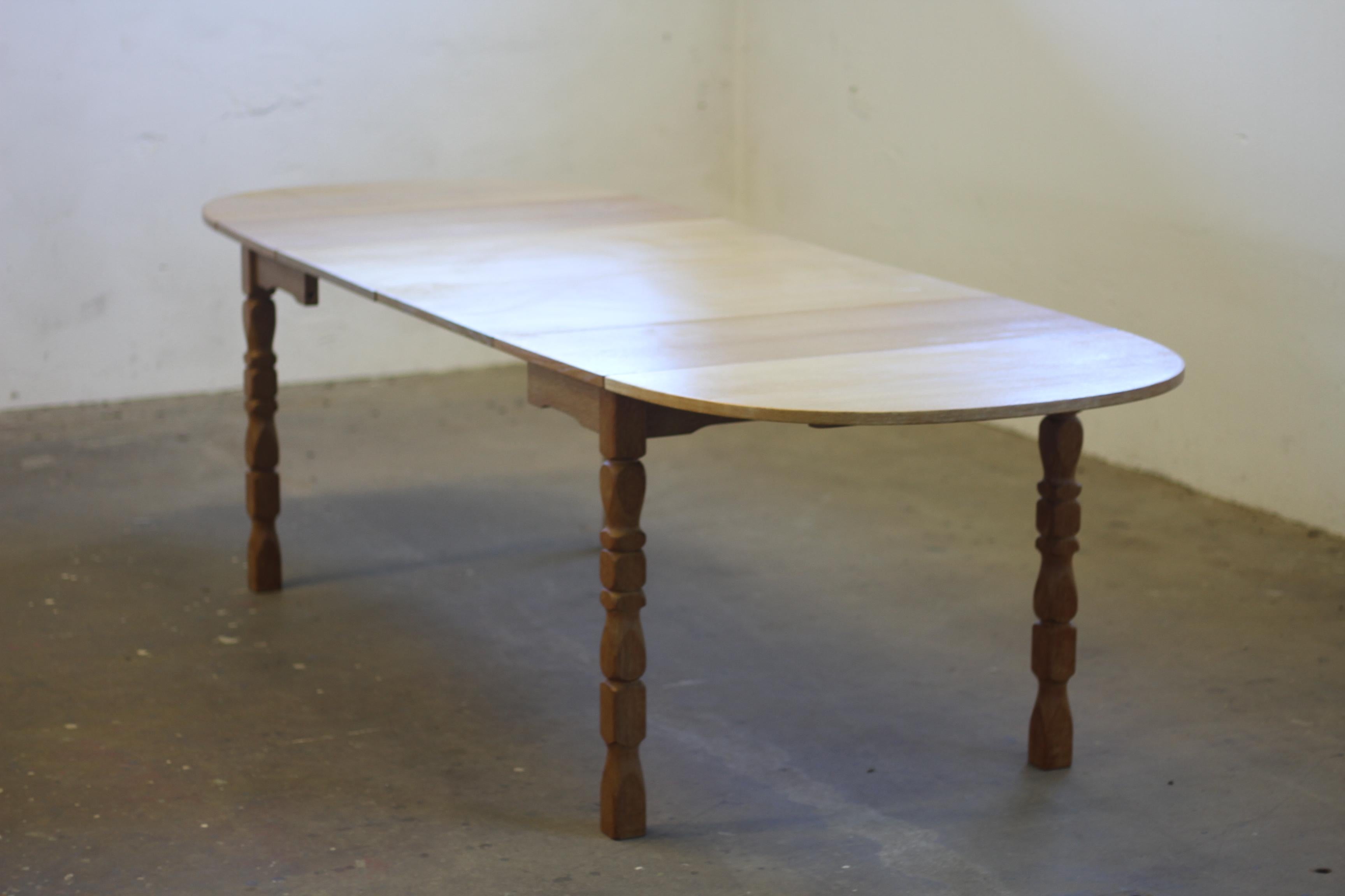 Danish Extendable Dining Table with leafs in Oak style of Henning Kjærnulf, 1960 For Sale 1