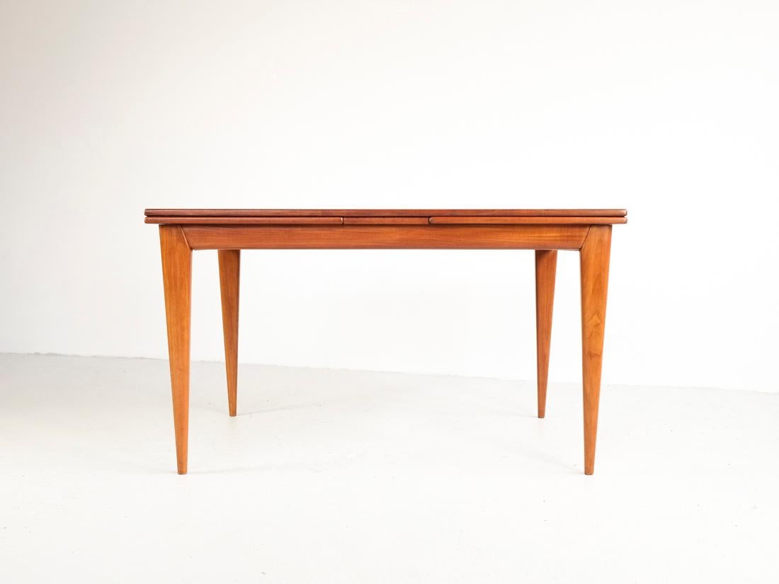 Midcentury dining table designed by Niels Otto Møller for J.L. Møllers Møbelfabrik in Denmark in the 1960s. The dining table is extendable on both sides. The table has very nice drawings in the wood and a beautiful design of the legs. The border and