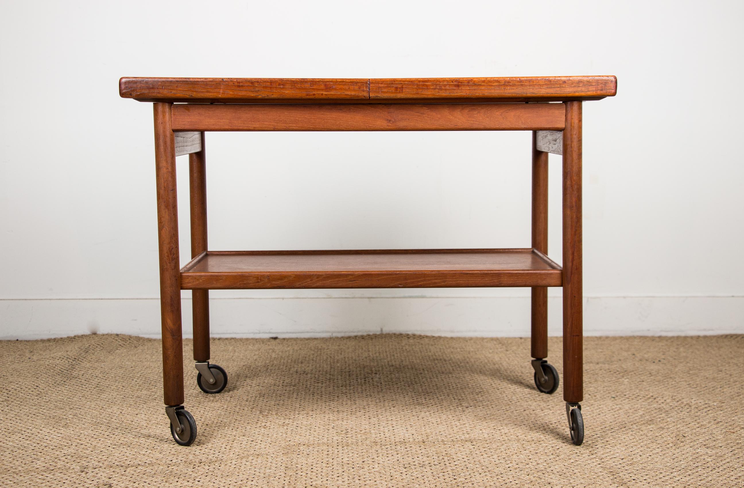 Scandinavian Modern Danish extendable two-tier teak serving table 1960 by Kurt Ostervig 1960. For Sale