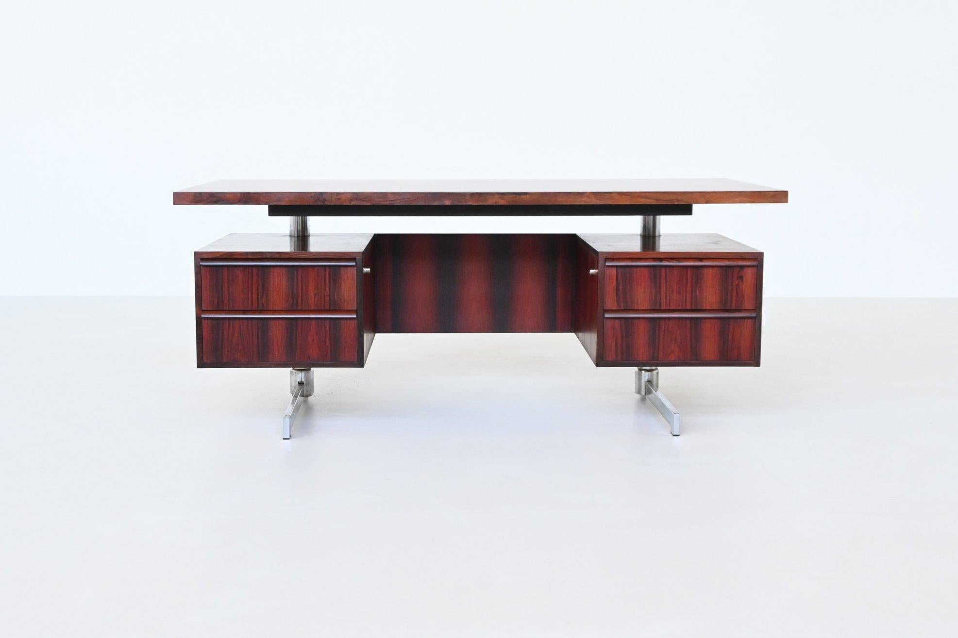 Very nice and elegant Danish executive desk by unknown designer, Denmark 1960. This desk expertly combines luxurious rosewood with sleek metal to create a striking piece of mid-century modern furniture. It features a distinctive floating top design,