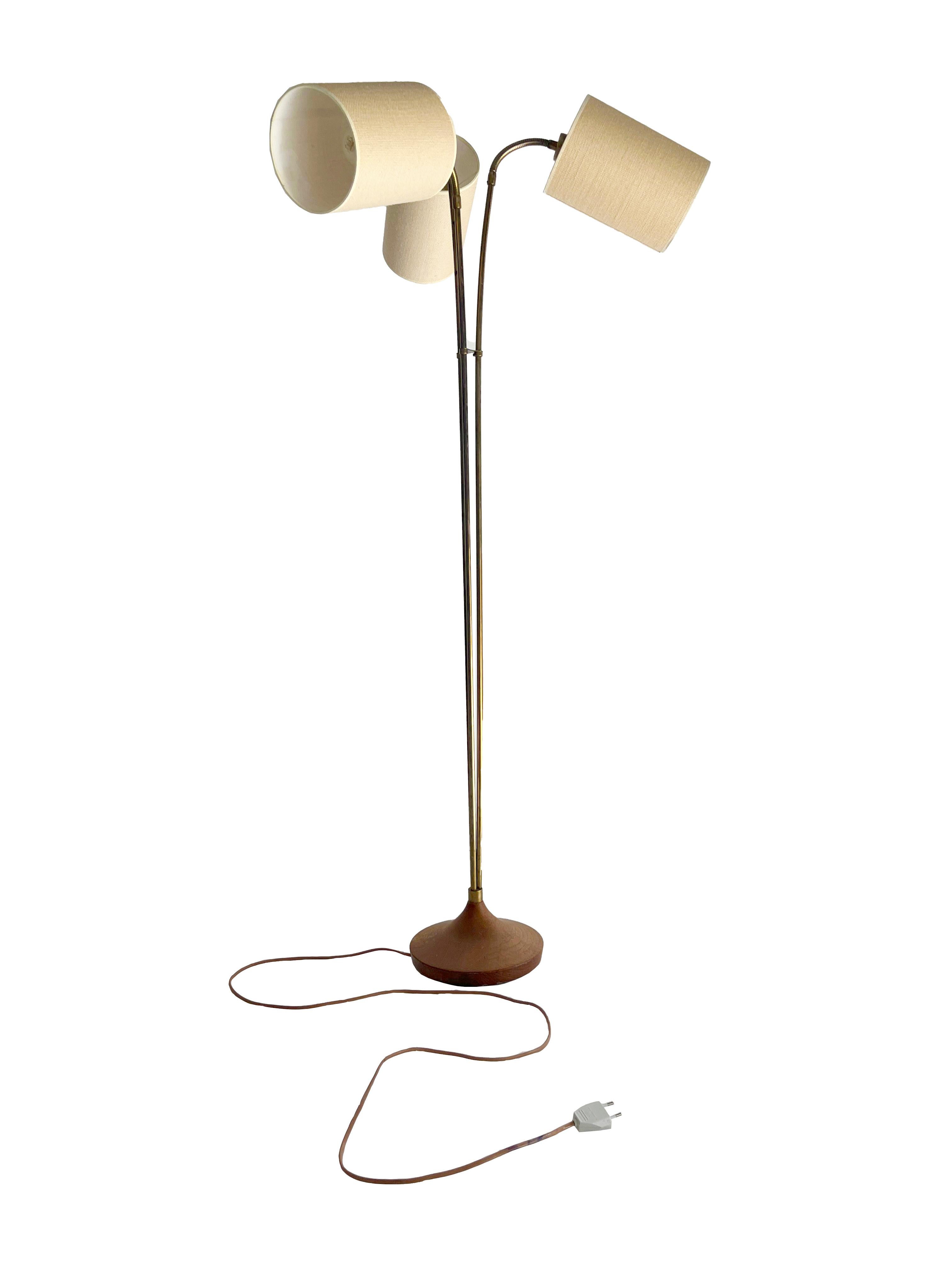 Brighten up your space with the retro charm and functional elegance of this 1970s Danish designer floor lamp. Featuring a solid wood base turned into a distinctive and original conical shape, this lamp combines traditional craftsmanship with modern,