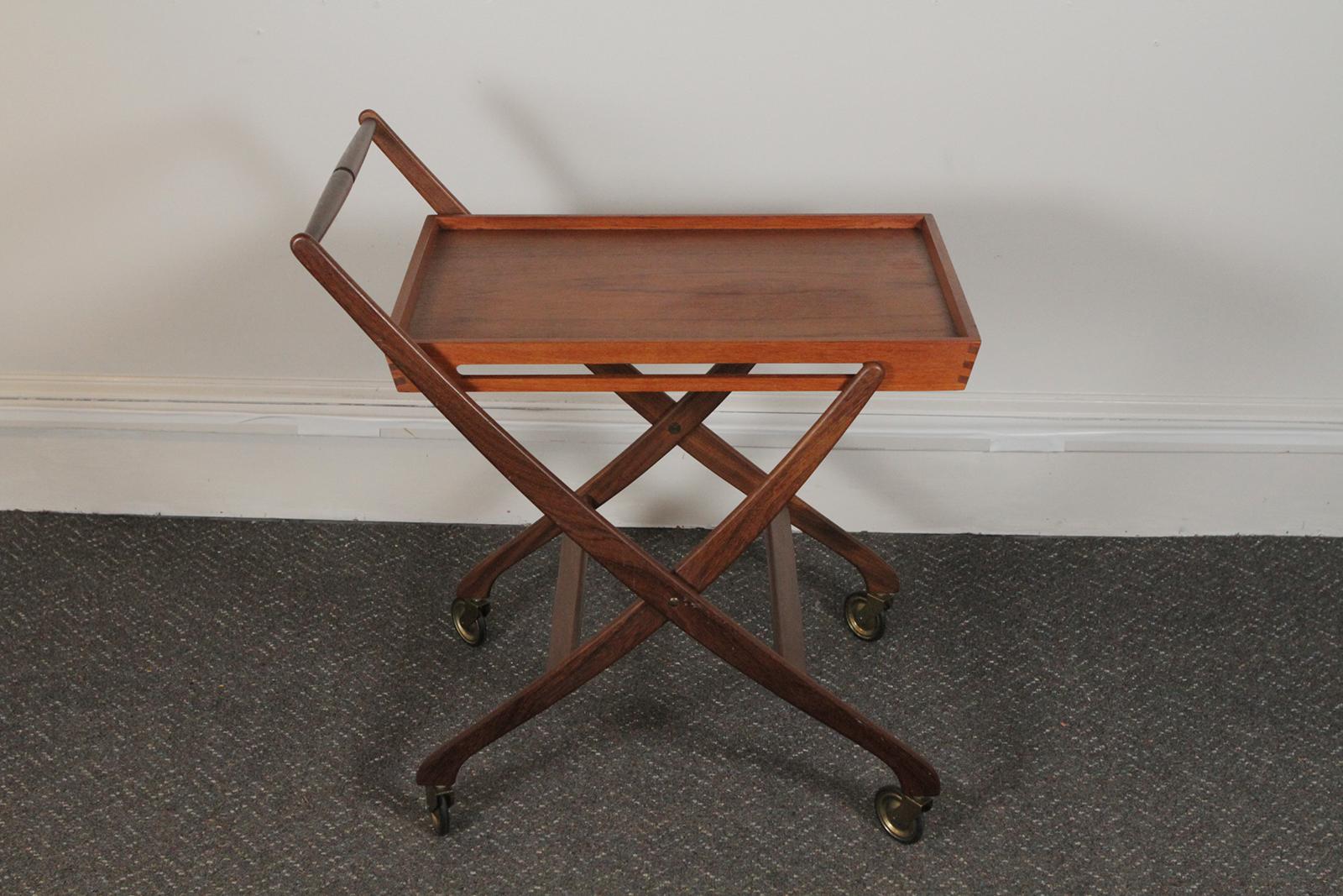 Folding Teak Bar cart, circa 1965, Denmark. Sleek lines and functional design. Marked on the underside with the Denmark Control mark. Dimensions: 28” W x 20” D x 29.5