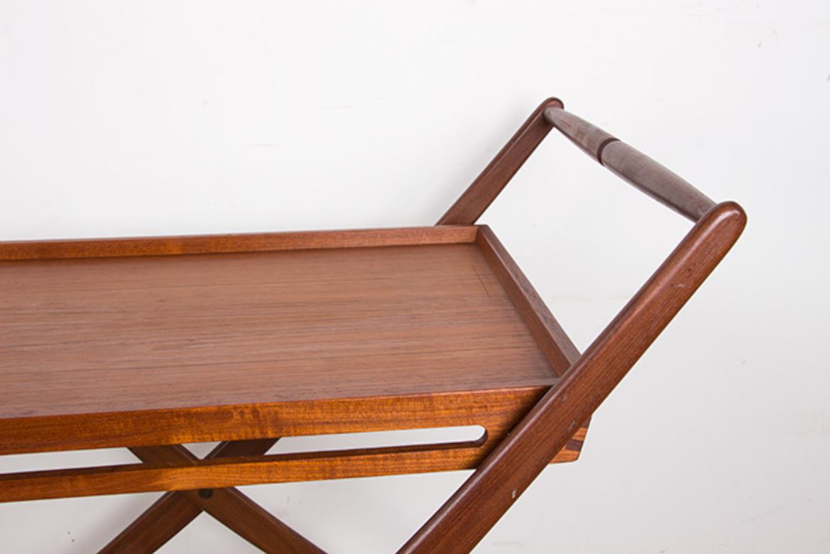 Scandinavian Modern Danish folding teak rolling table by Svend Aage Madsen for Illums Bolhigus 1960. For Sale