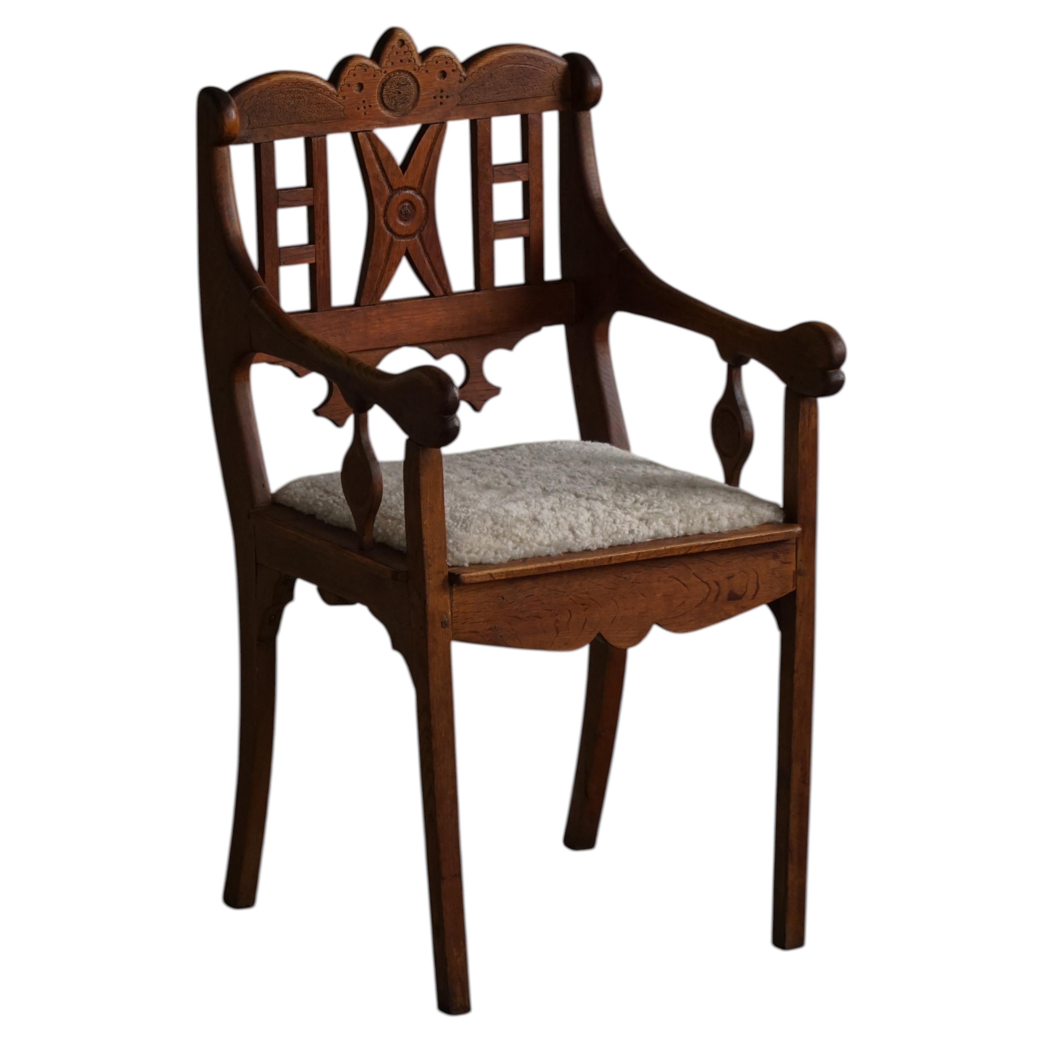 Danish Folk Art Armchair in Oak & Lambswool Seat, Early 20th Century, 1930s