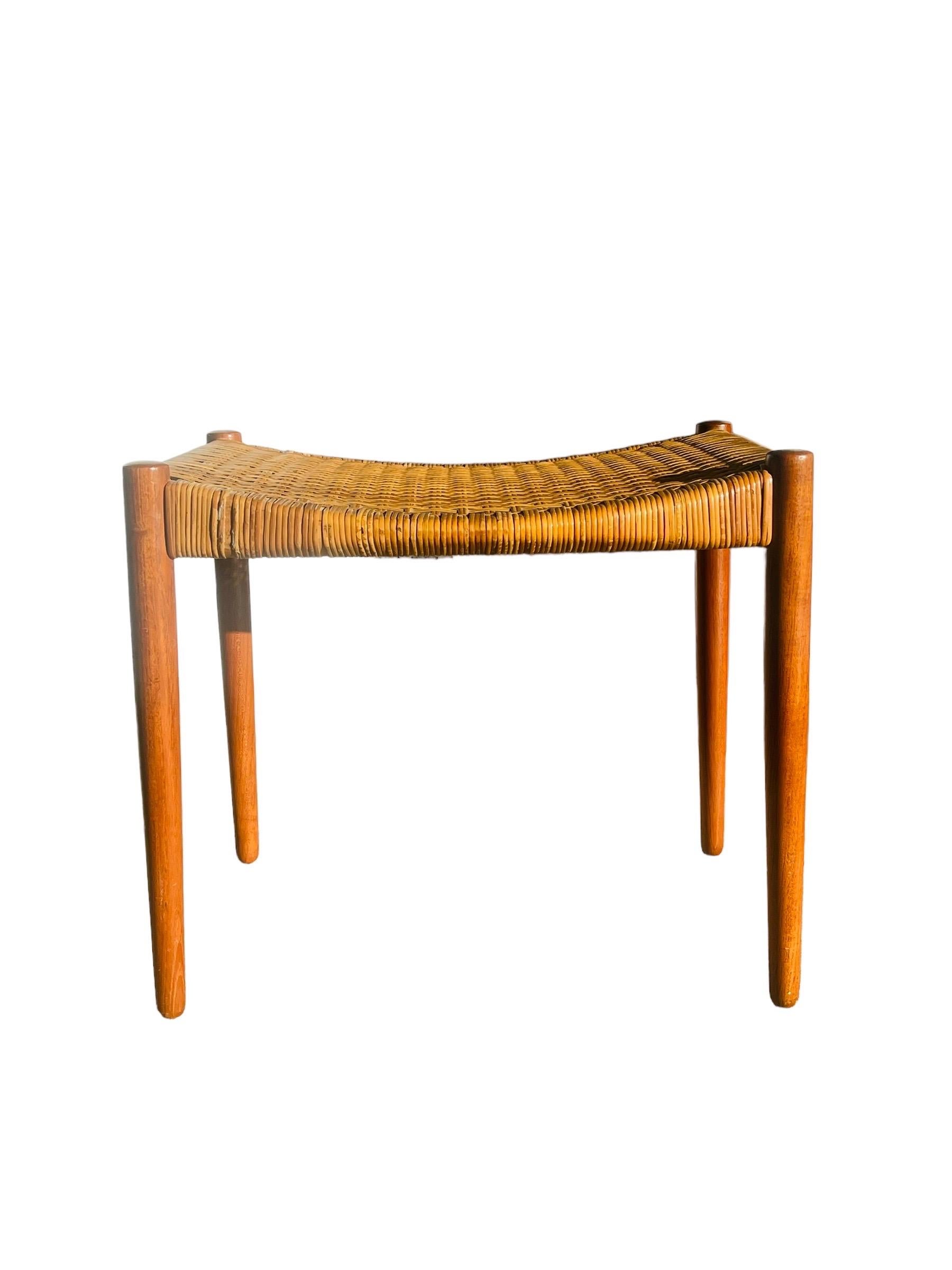 Rare Danish modern Teak footstool designed by Aksel Bender Madsen & Ejner Larsen. Produced by cabinetmaker Willy Beck in Denmark. This stool is in good original & vintage condition with  wear consistent with age and use. 

W 22