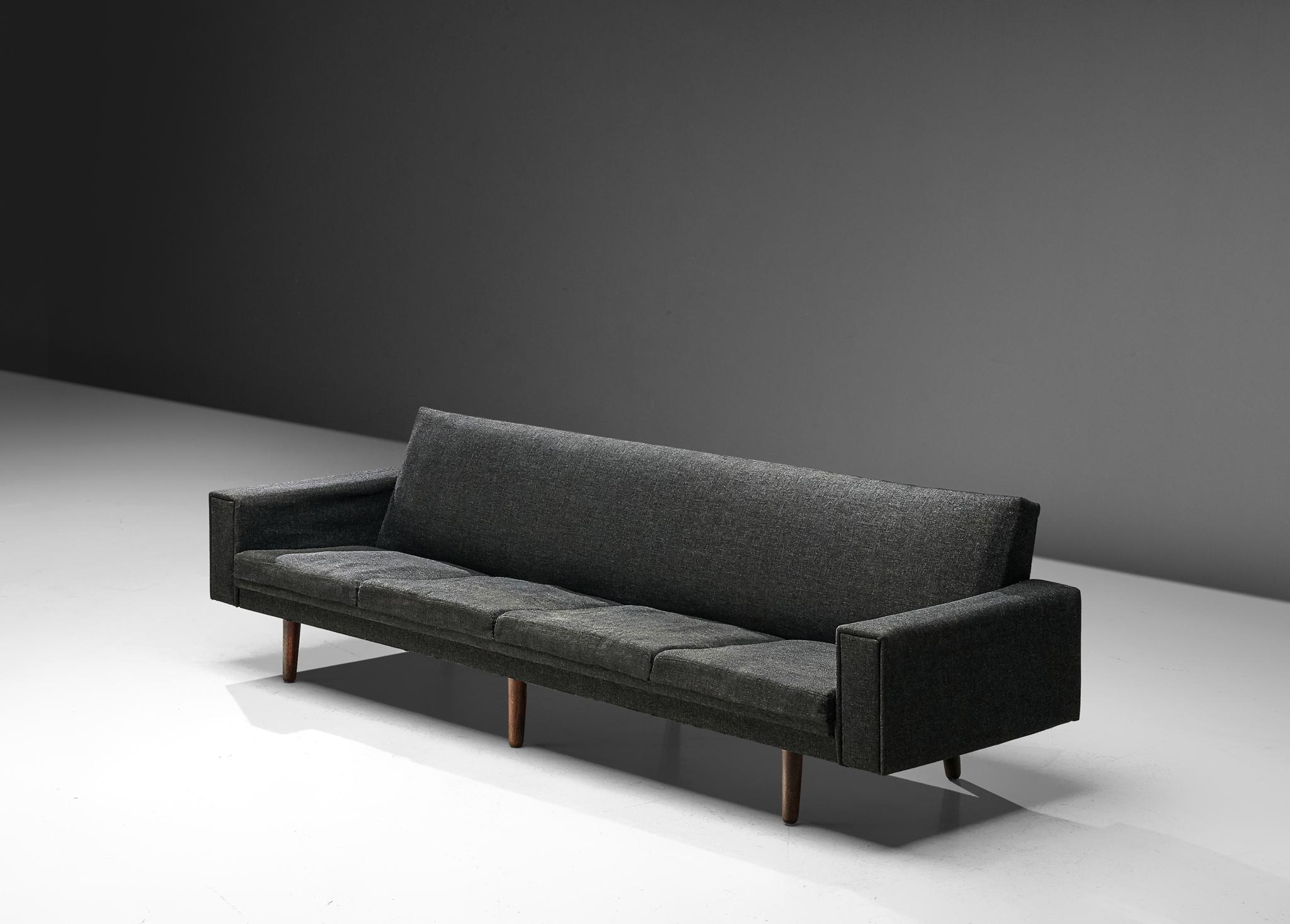 Sofa, fabric, wood, Denmark, 1960s

This well-executed sofa convinces visually through the well-balanced appearance and the stabile construction. The corpus is based on understated simplicity where clear, sharp lines are allowed to emerge in the