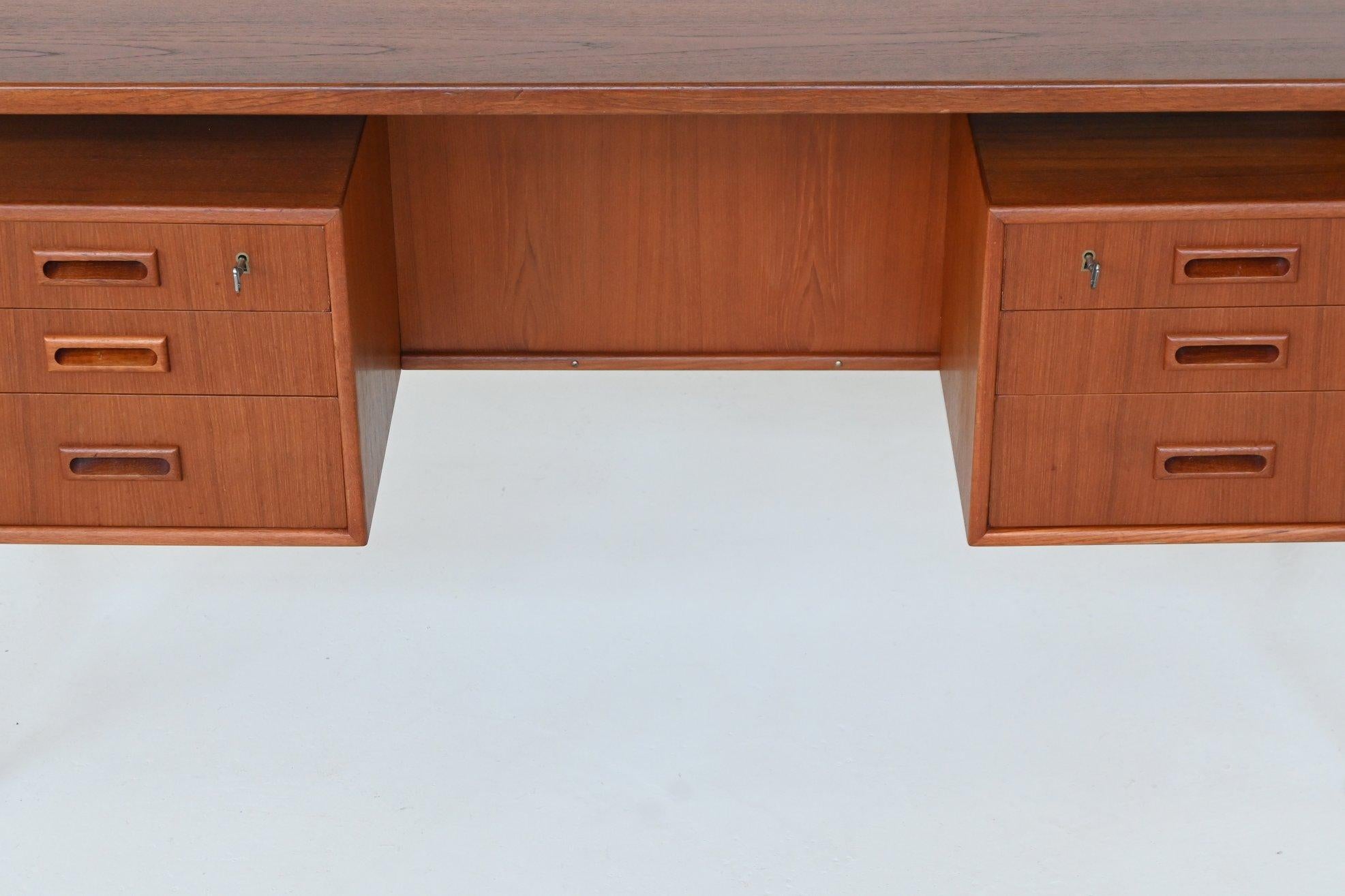 Teak Danish freestanding symmetric desk in teak Denmark 1960 For Sale