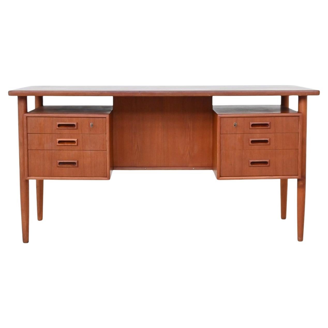 Danish freestanding symmetric desk in teak Denmark 1960