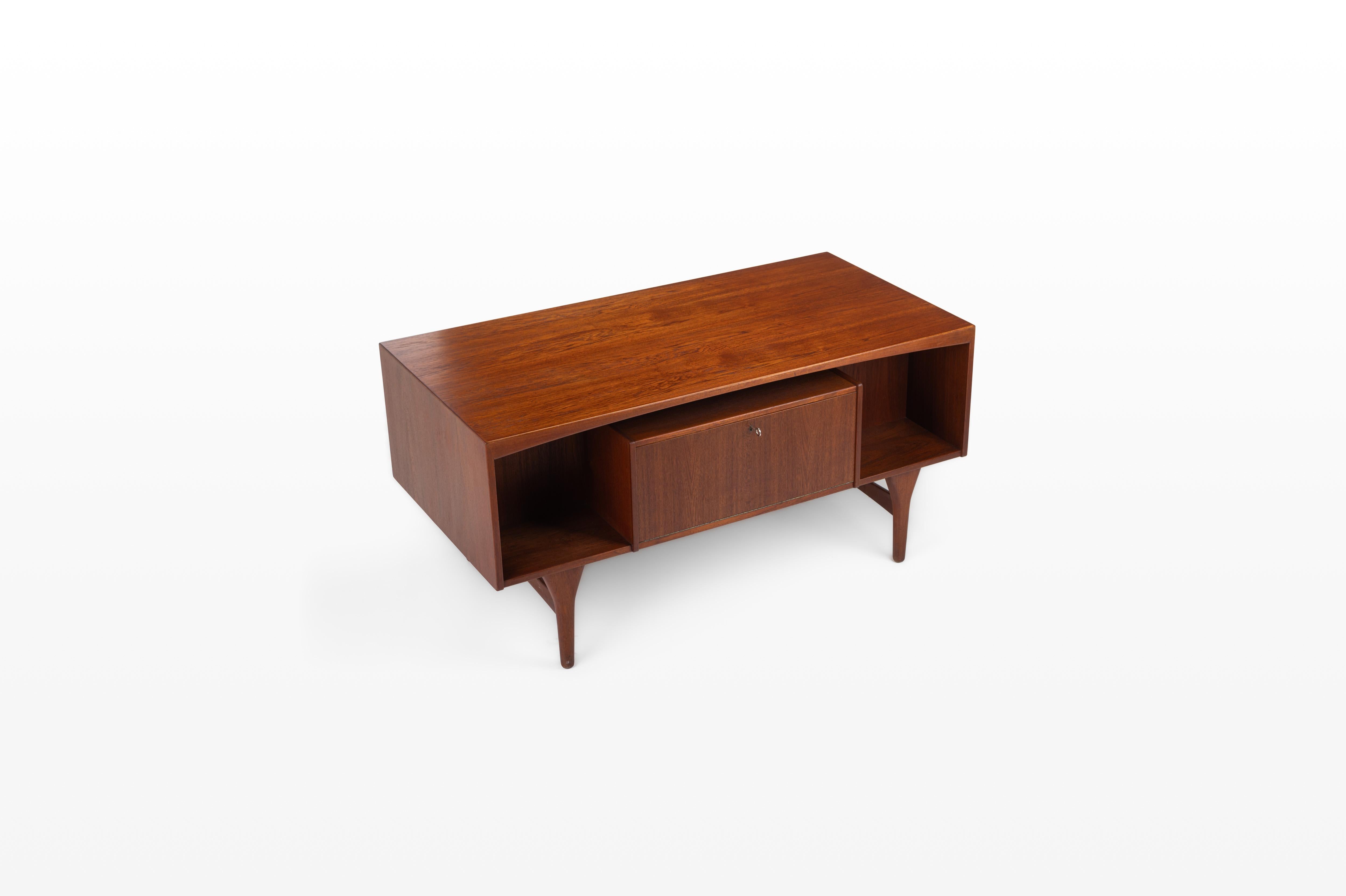 Beautiful vintage writing desk in teak produced by Valdemar Mortensen, Denmark 1960s. There are six drawers and a bar area. This desk is in very good restored condition and marked by the producer.
