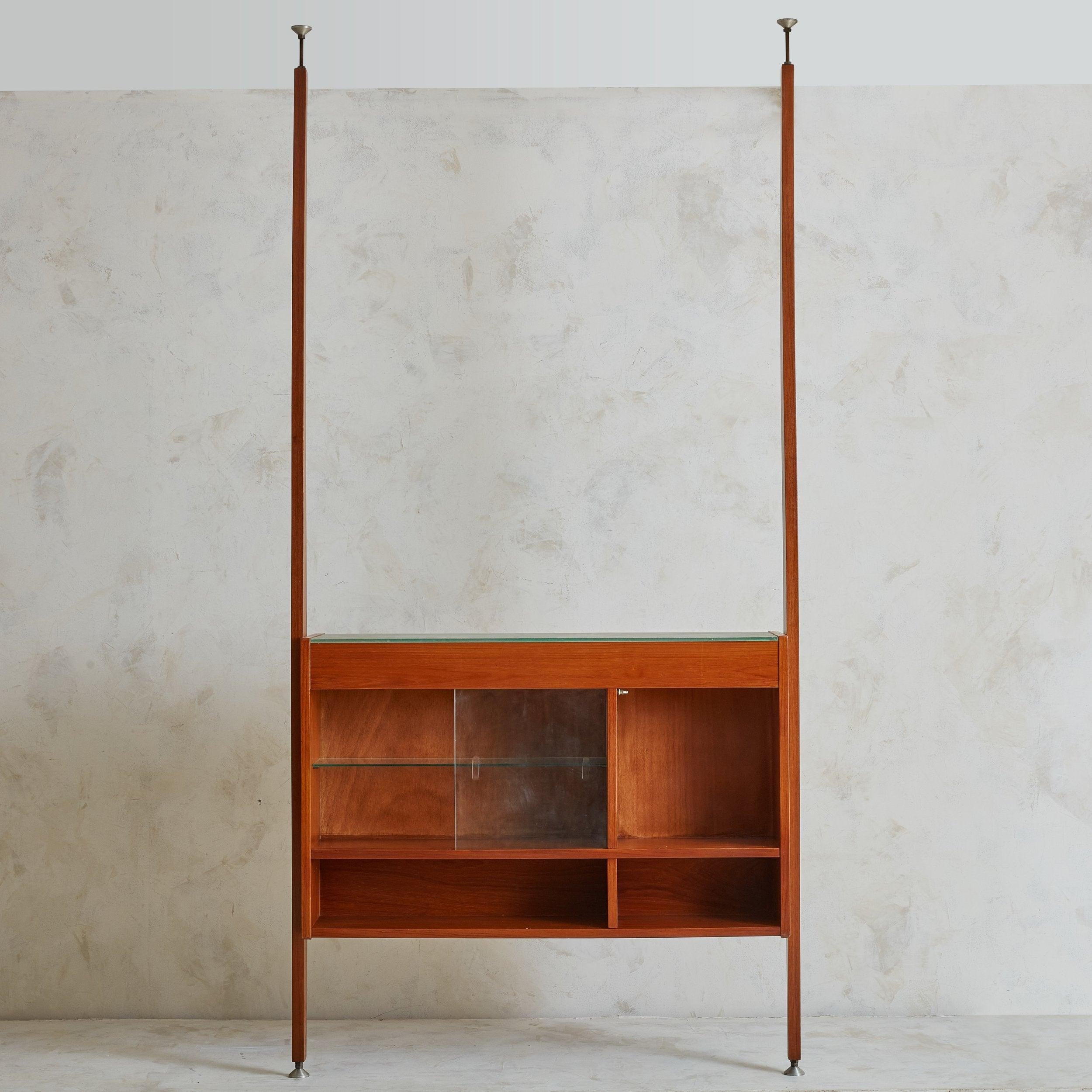 A 1970s Scandinavian Modern bar attributed to Danish designer and manufacturer Poul Cadovius. This piece captures the essence of mid-century design with its warm fruitwood construction and minimalist silhouette. Clean lines define its profile, with