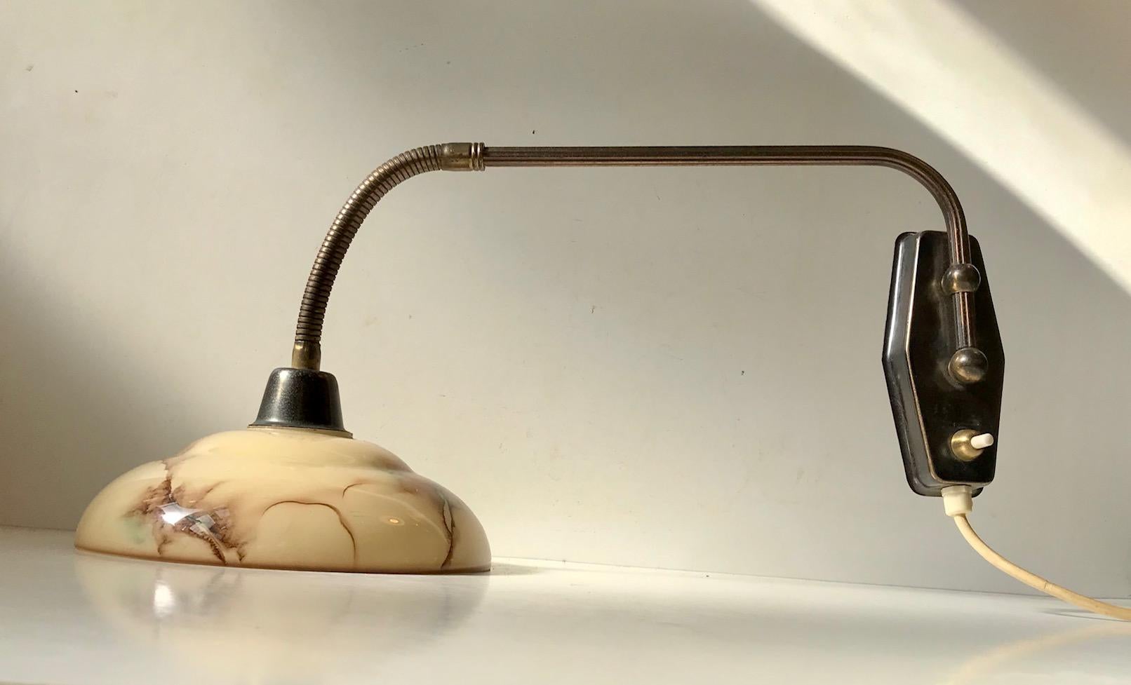 Fully adjustable wall lamp designed and manufactured by Th. Valentiner in Copenhagen, Denmark during the 1950s. It features a marbled glass shade, flexible gooseneck and on/off switch to the wall base.