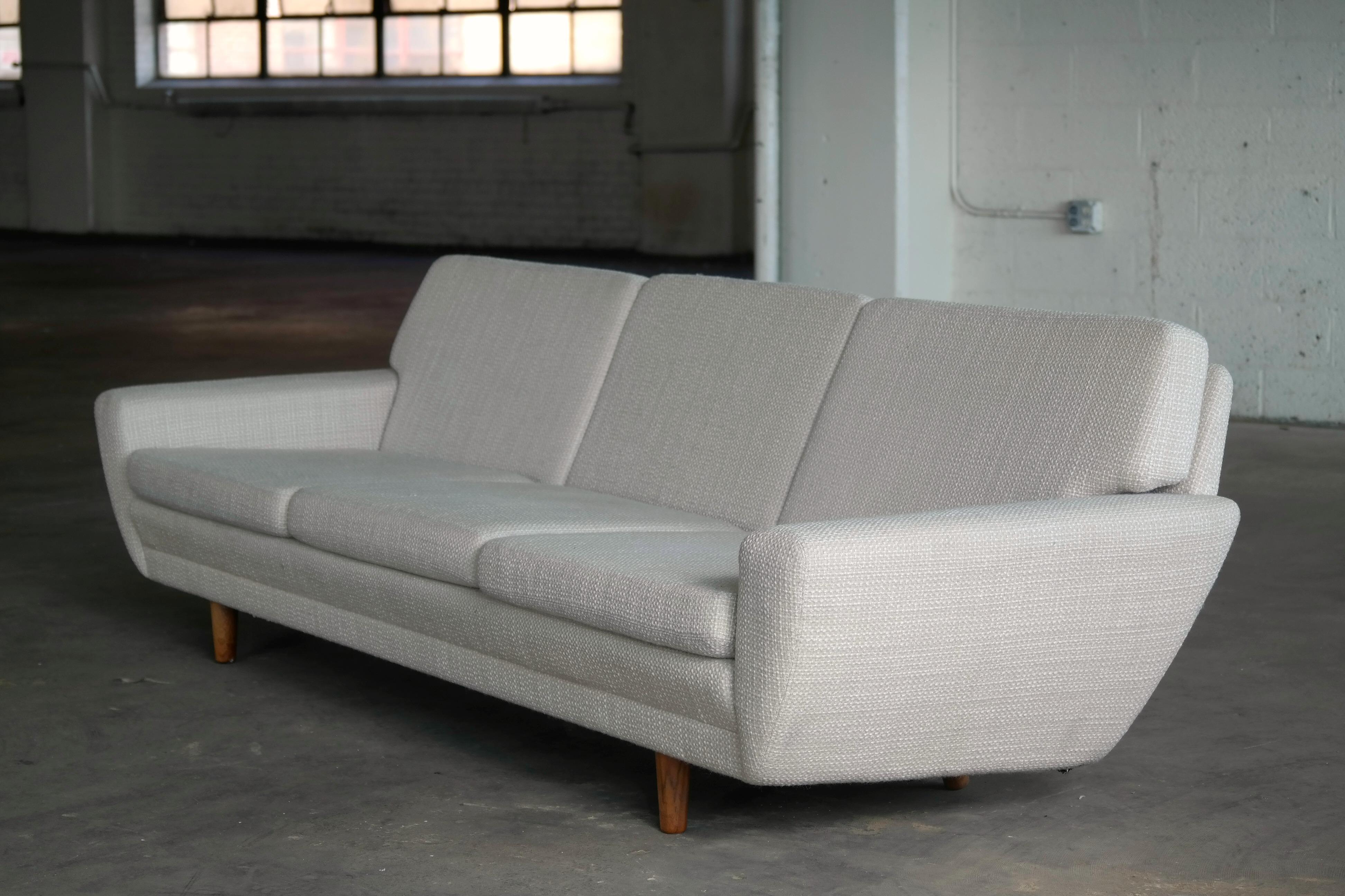 Beautiful large sofa Designed by Danish Designer, Georg Thams in 1968 as part of sofa group model 79 made by Vejen Polstermøbelfabrik for high-end Danish retailer, Domus Danica. While a beautiful very elegant design the sofa also have a nice